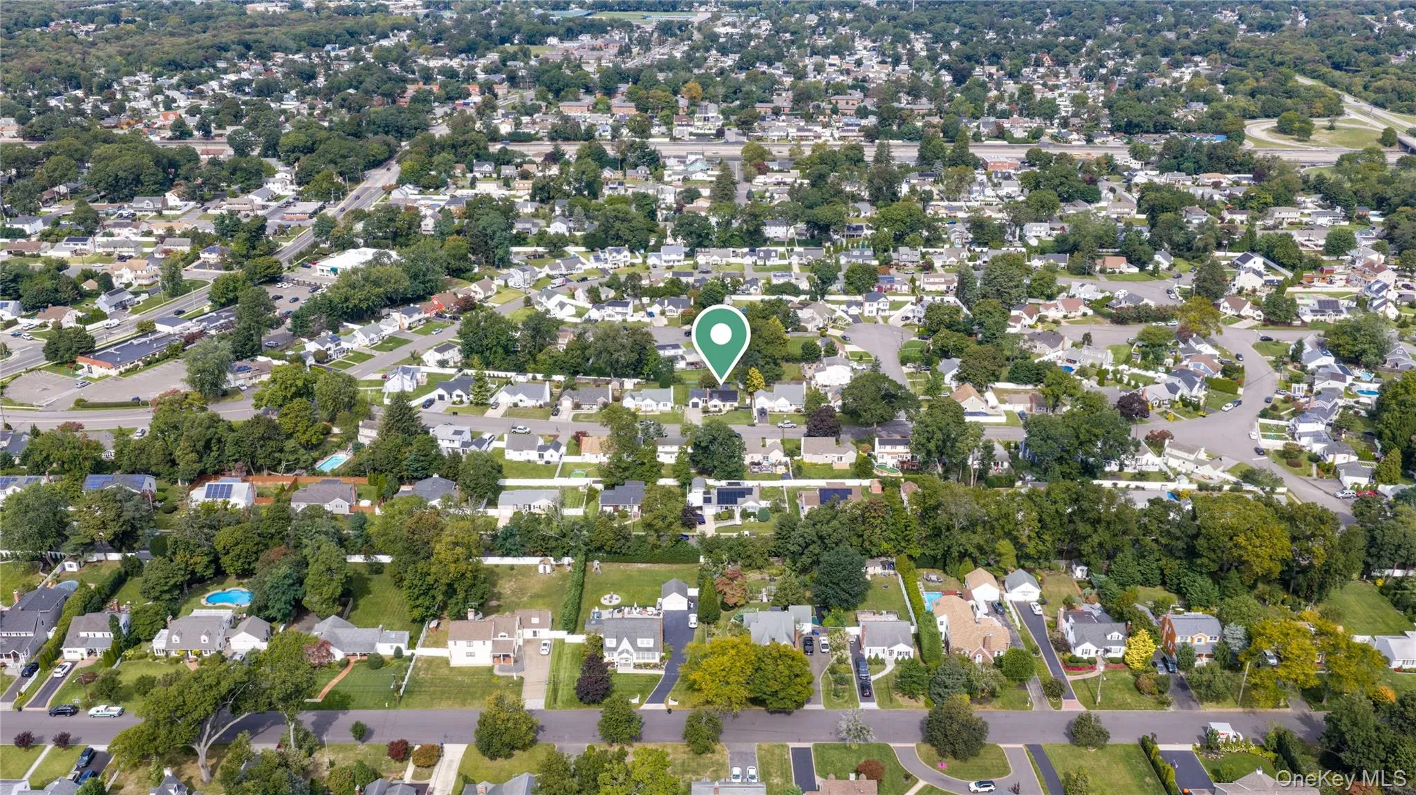Wider aerial view of house in broader neighborhood Wider aerial view of house in broader neighborhood