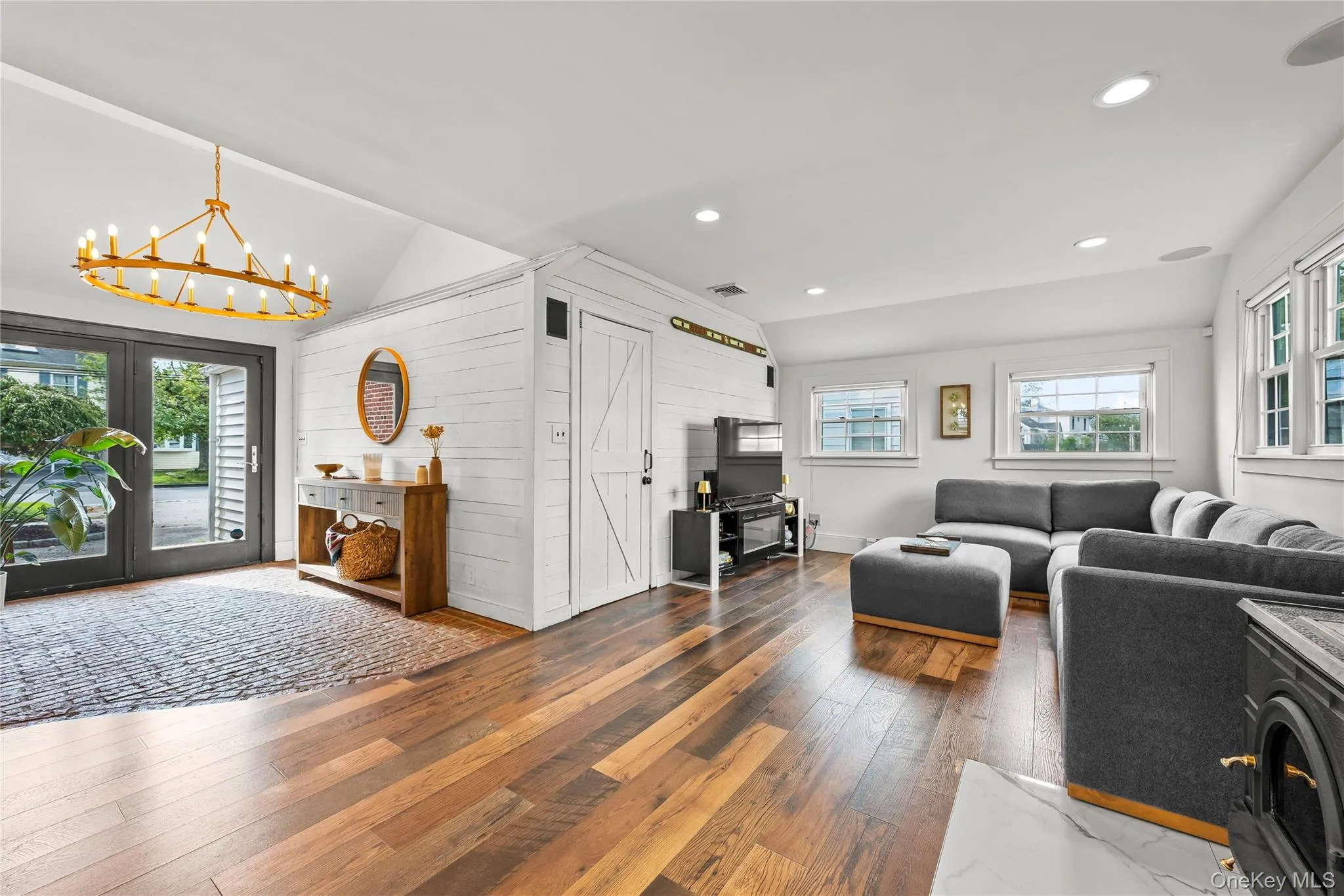 Vaulted ceilings and recessed lighting complement the wood-finish flooring Vaulted ceilings and recessed lighting complement the wood-finish flooring