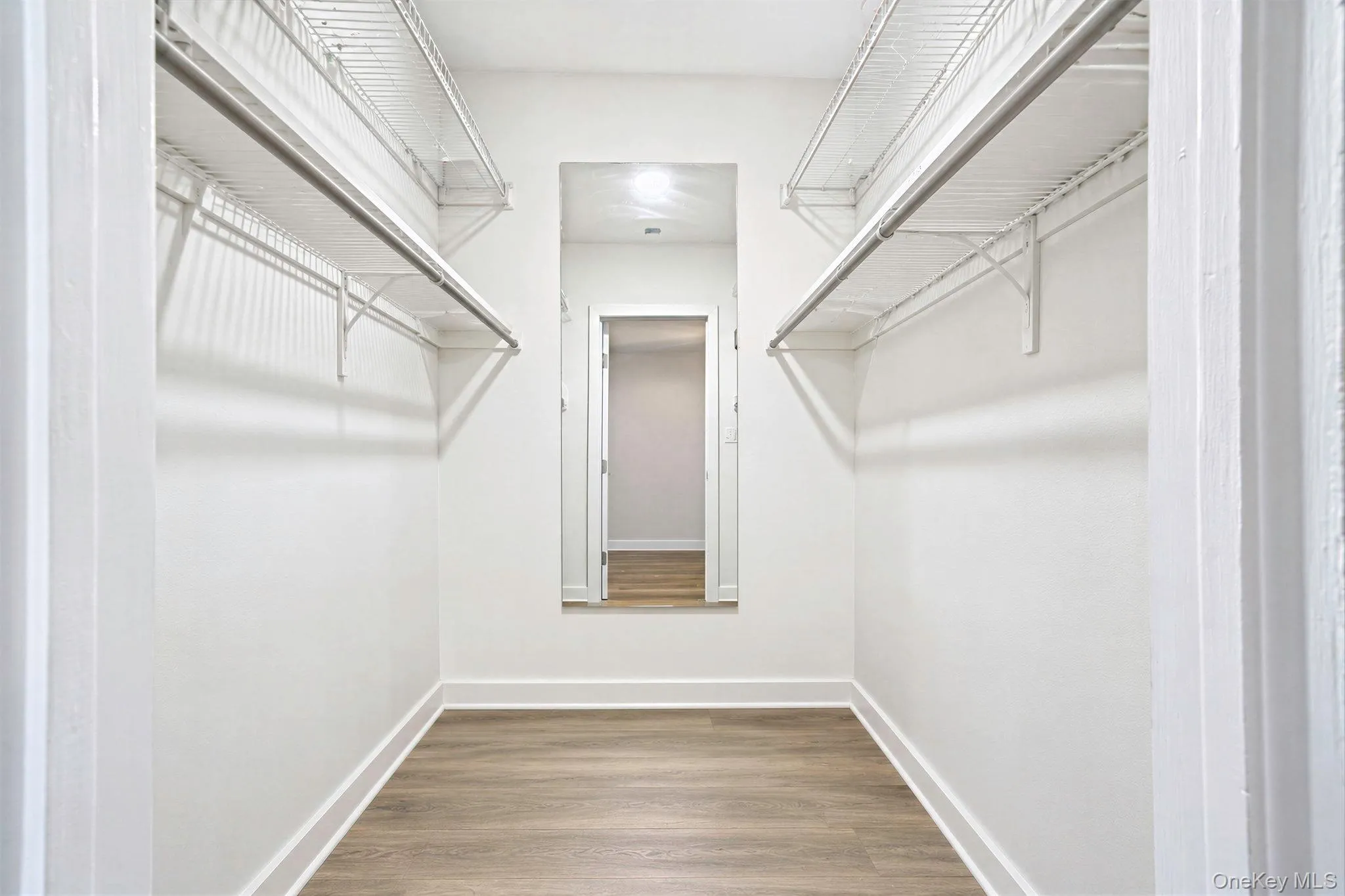 Primary bedroom walk in closet Primary bedroom walk in closet