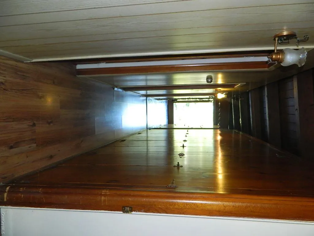 Floor to ceiling knotty pine cabinets all the way down the hallway, storage galore Floor to ceiling knotty pine cabinets all the way down the hallway, storage galore