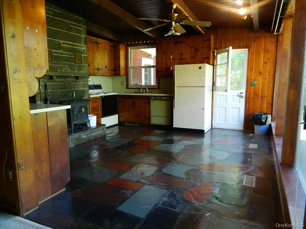 Charming kitchen with wood burning stove, slate floor, knotty pine cabinets and a dutch door! Charming kitchen with wood burning stove, slate floor, knotty pine cabinets and a dutch door!