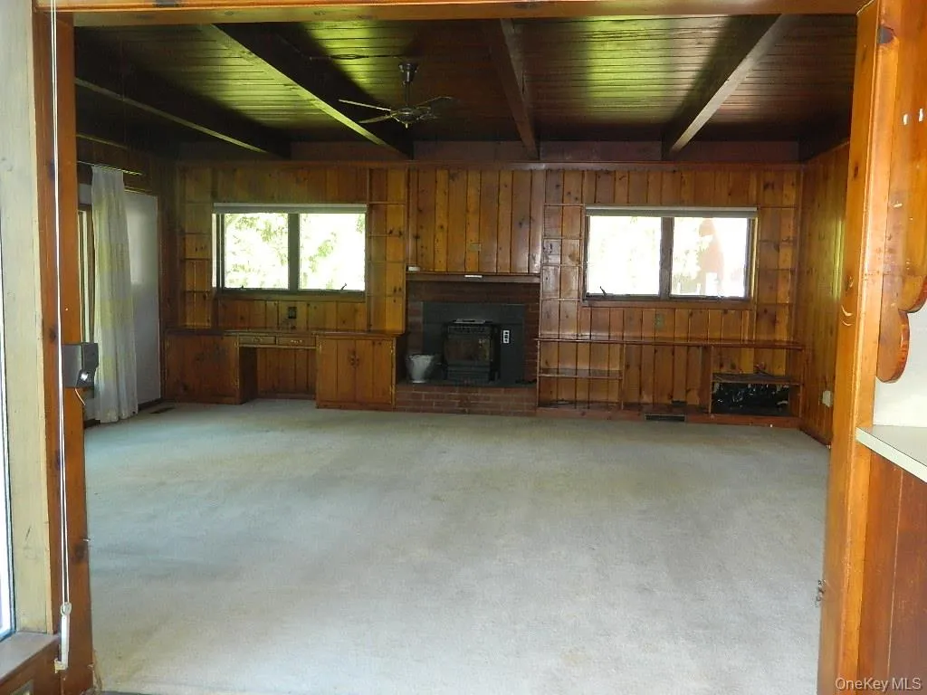 With pellet stove, built ins and wonderful windows With pellet stove, built ins and wonderful windows
