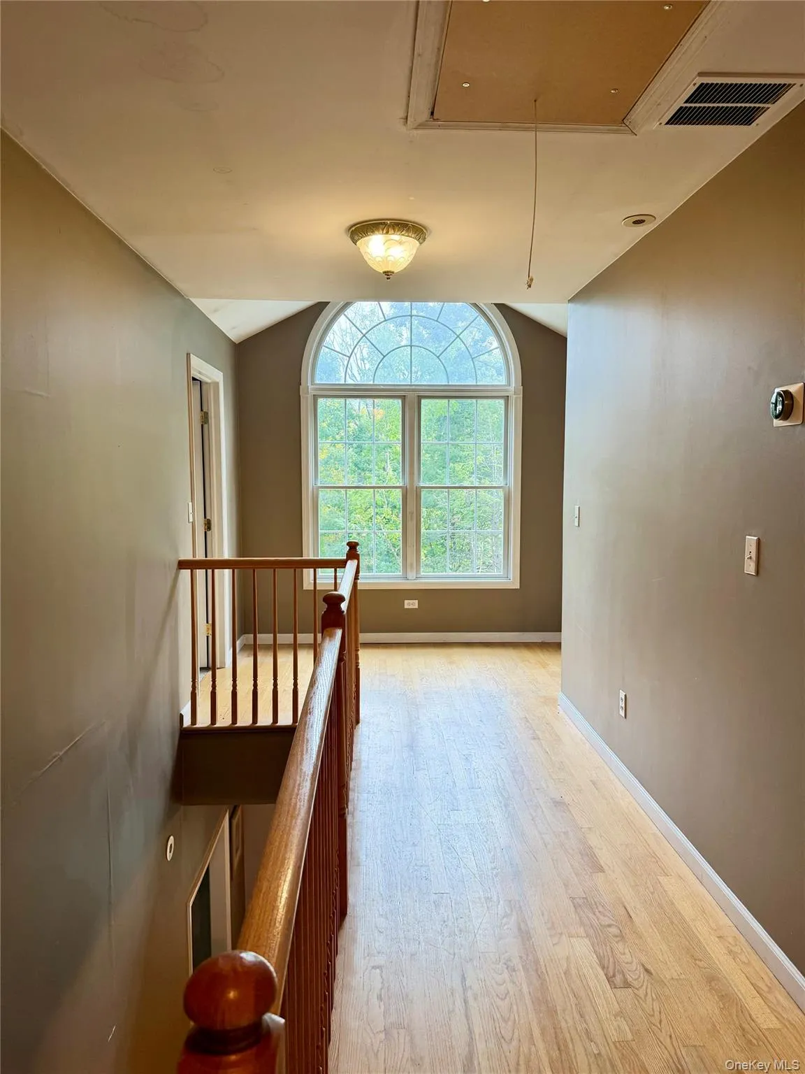 Light-filled upstairs hall with lovely oversized accent window and hardwood floors throughout! Light-filled upstairs hall with lovely oversized accent window and hardwood floors throughout!