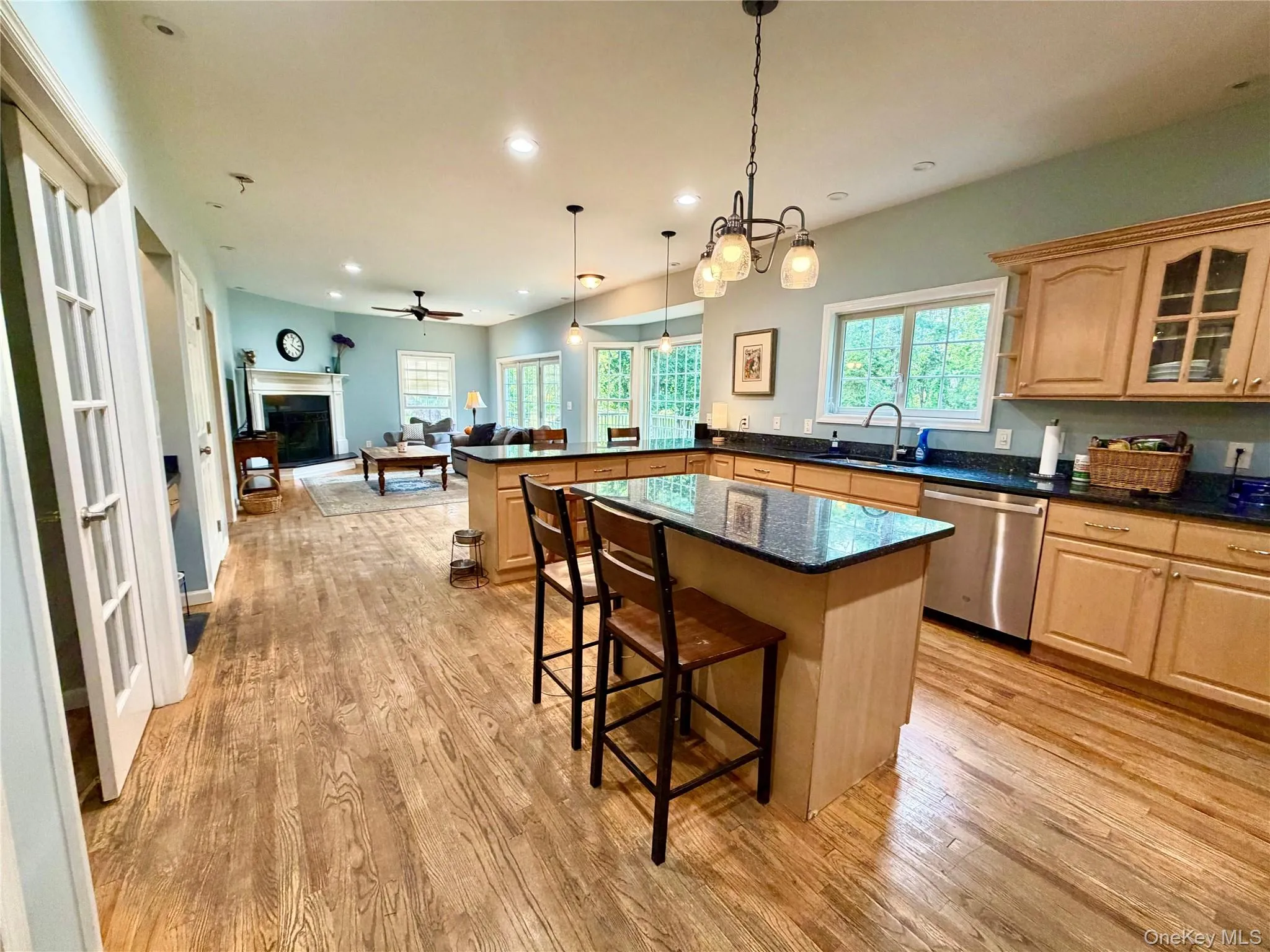 French doors lead from the kitchen to the dining room and sliders in the family room exit to the large rear deck and yard. French doors lead from the kitchen to the dining room and sliders in the family room exit to the large rear deck and yard.