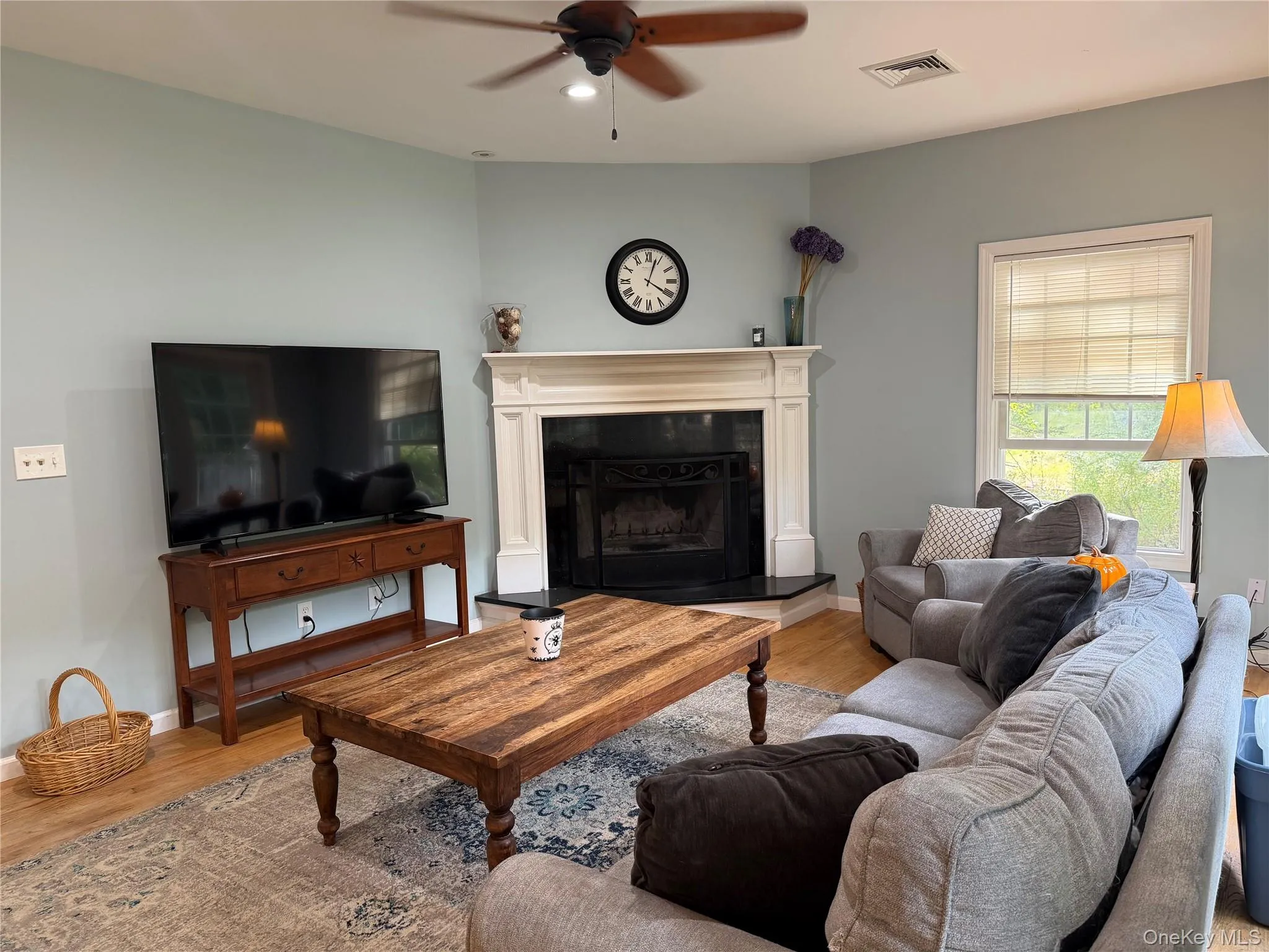 Lovely oversized wood-burning fireplace and sliders out to the lovely yard and deck. Lovely oversized wood-burning fireplace and sliders out to the lovely yard and deck.
