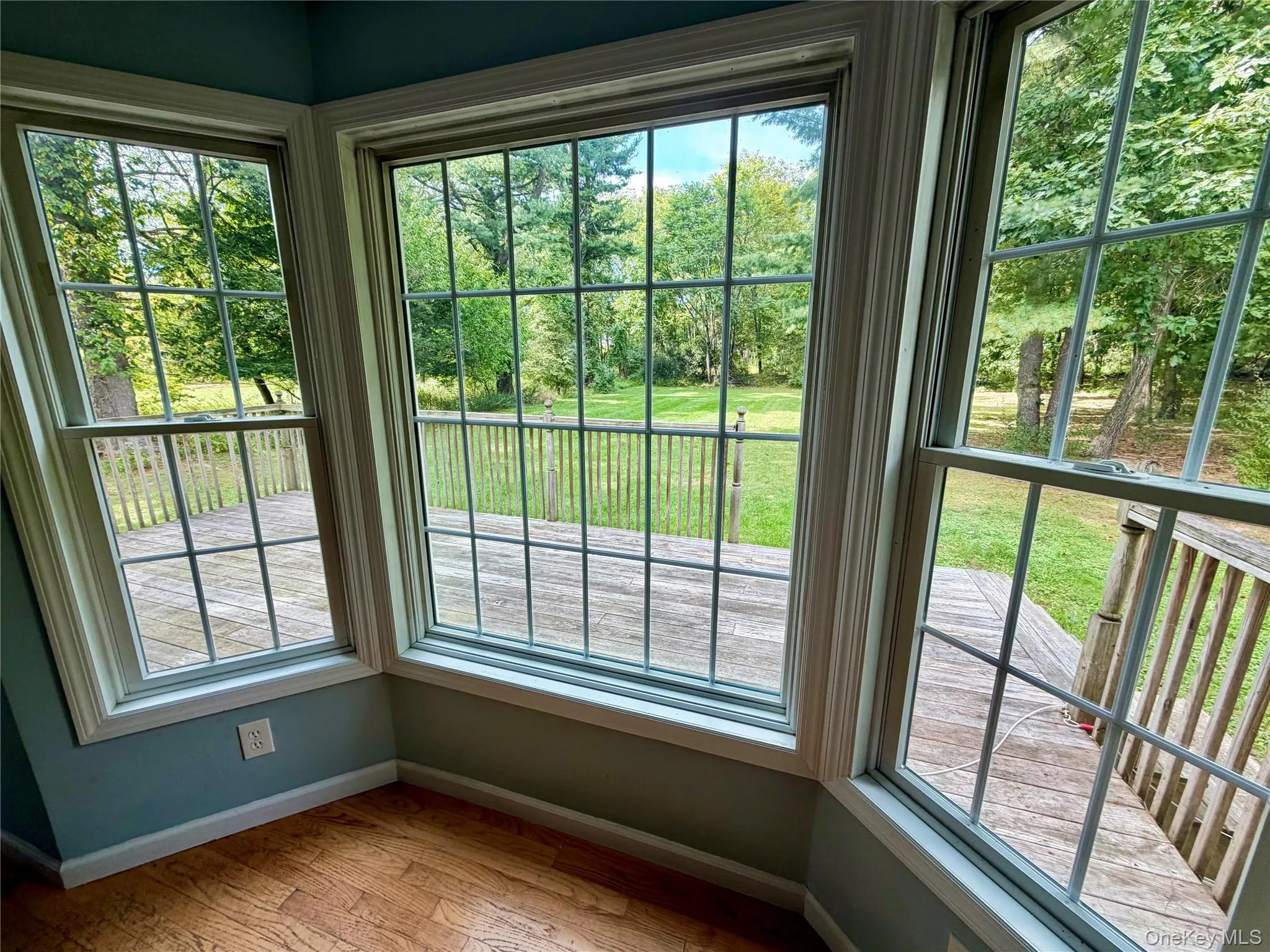 Lovely bay window area in the kitchen/living room overlooking the space flat backyard and large deck. Lovely bay window area in the kitchen/living room overlooking the space flat backyard and large deck.