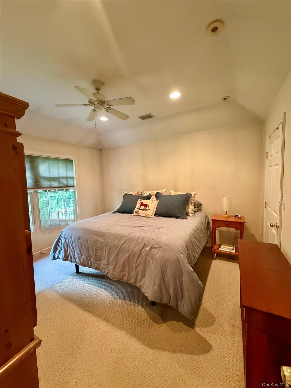 Large bedroom with a tray ceiling just across from the hall bath. Large bedroom with a tray ceiling just across from the hall bath.