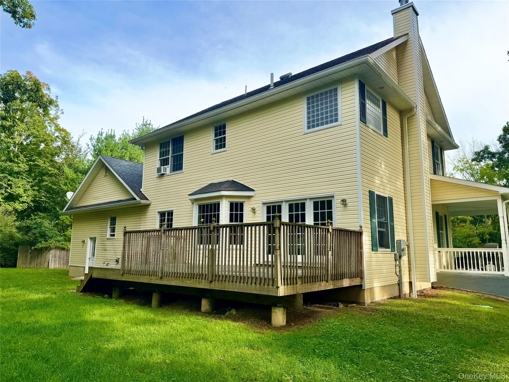Large back deck with sliders out from the living room/kitchen area! Great for entertaining! Large back deck with sliders out from the living room/kitchen area! Great for entertaining!