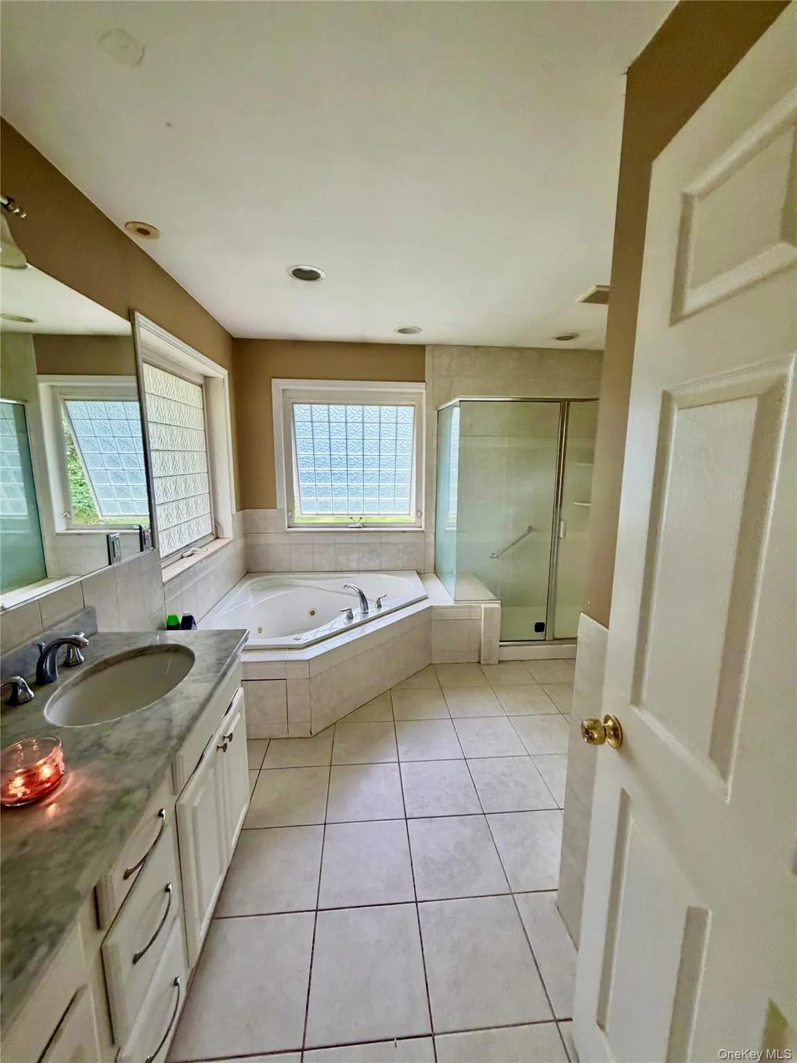 Over-sized en-suite bath off of the primary bedroom offers a double vanity, jetted tub, standing shower, separate toilet area and large walk-in closet! Over-sized en-suite bath off of the primary bedroom offers a double vanity, jetted tub, standing shower, separate toilet area and large walk-in closet!