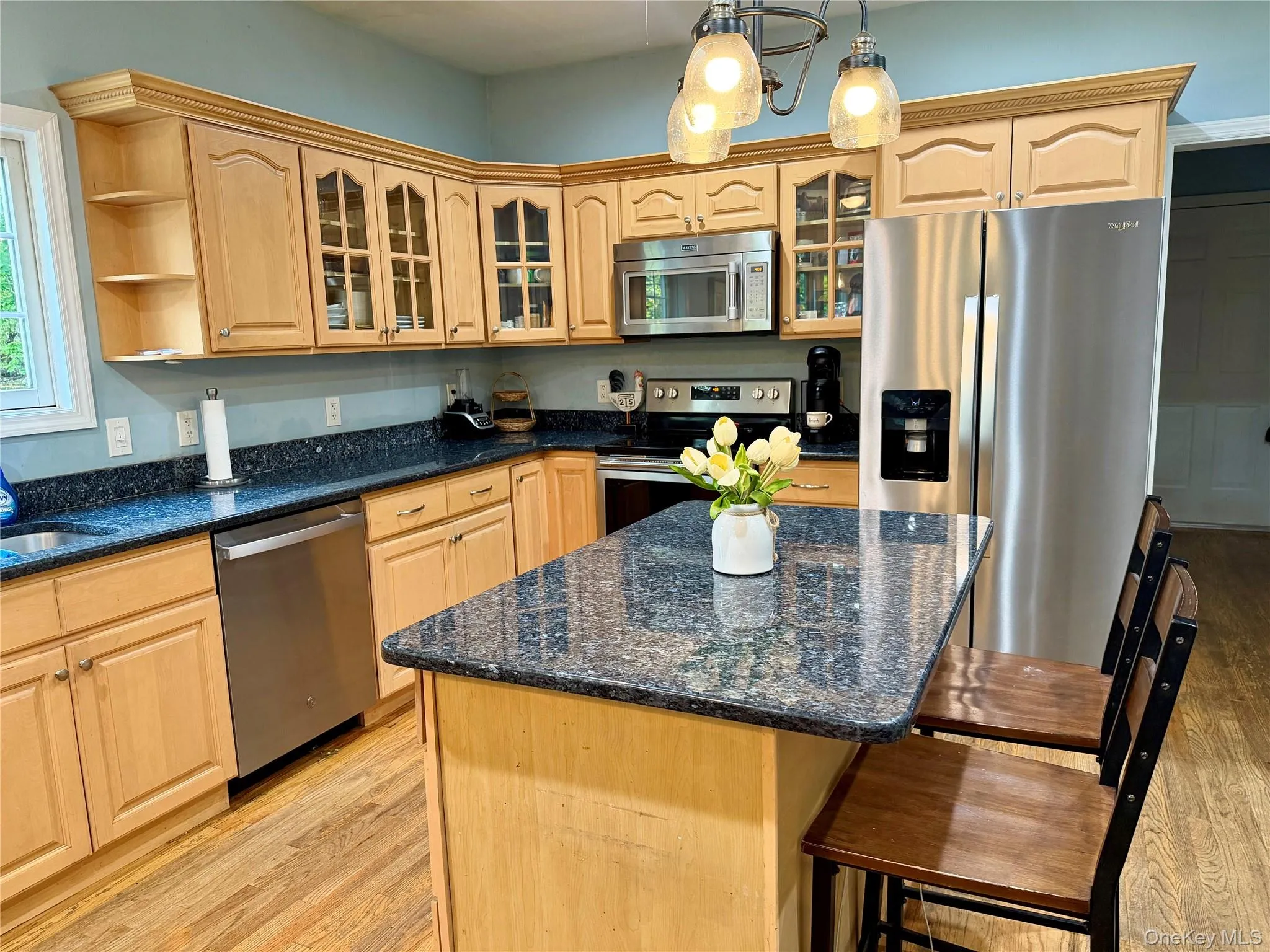 All stainless appliances and loads of cabinets. Head down the hall to the laundry room, powder room and garage for extra convenience. All stainless appliances and loads of cabinets. Head down the hall to the laundry room, powder room and garage for extra convenience.