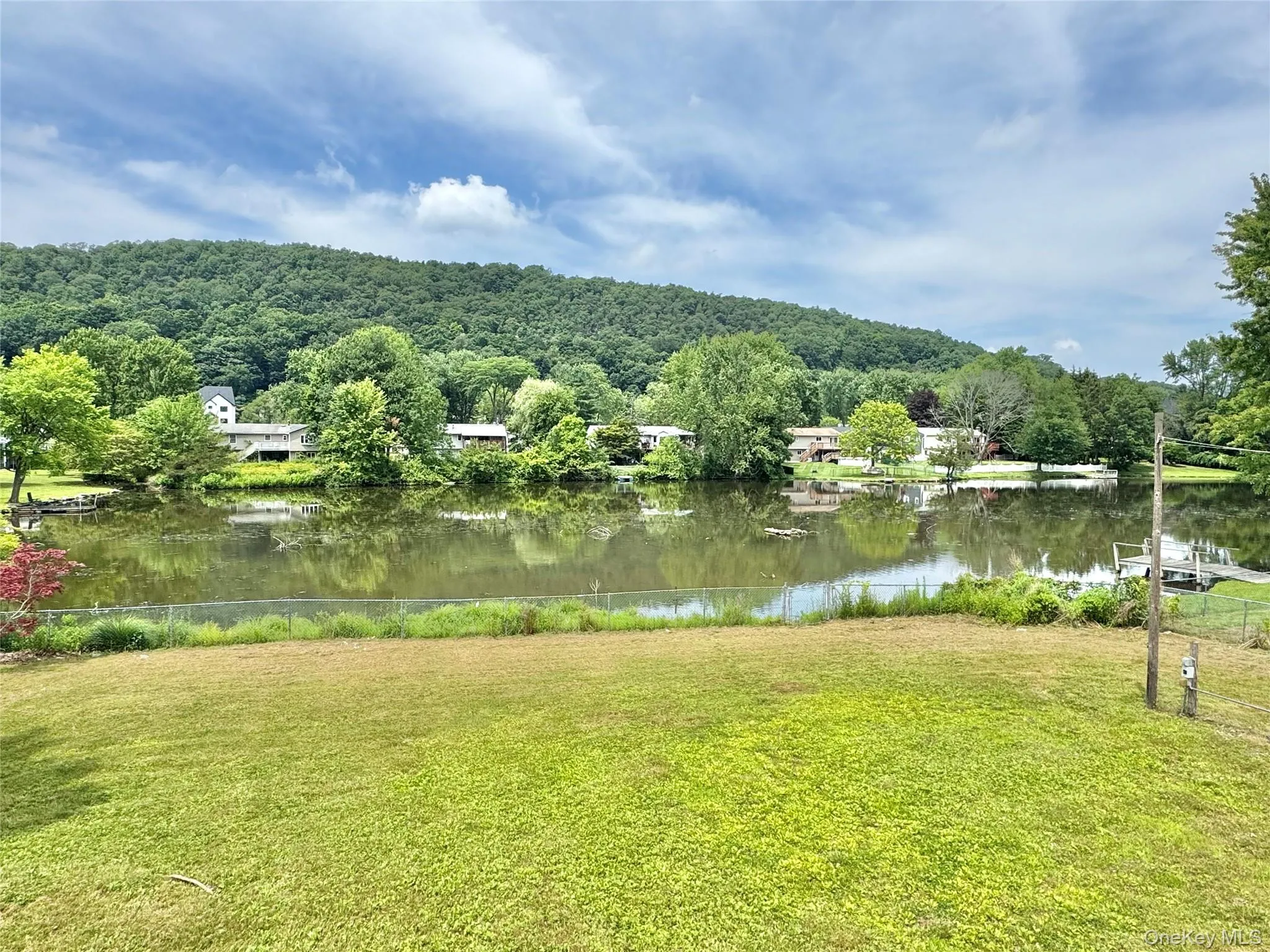 Water view with a heavily wooded area Water view with a heavily wooded area