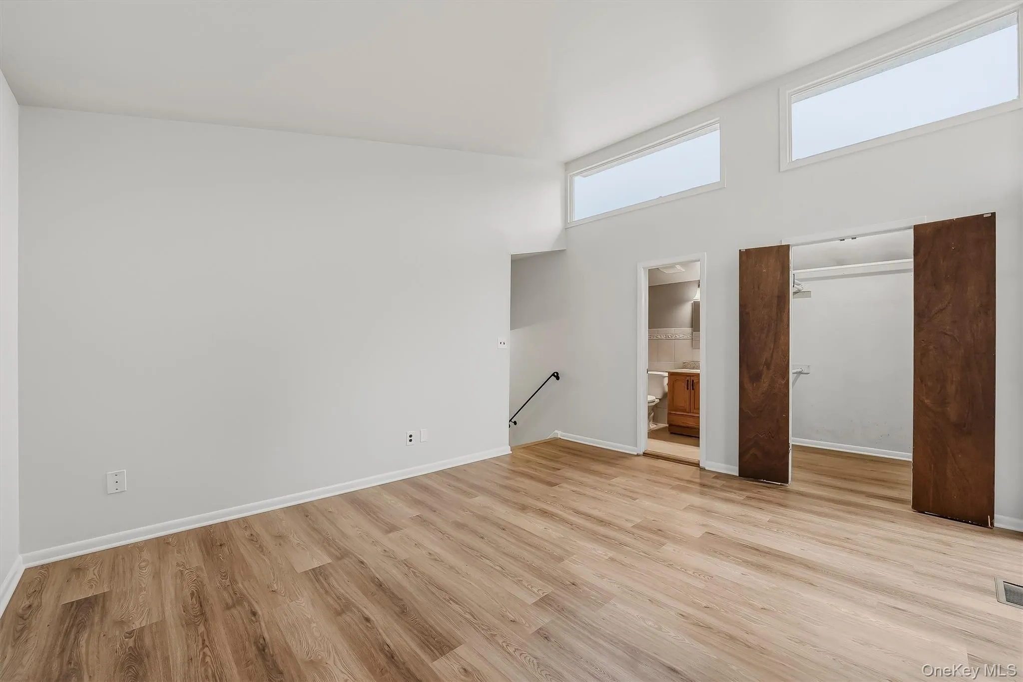 Primary bedroom with brand new floors, en-suite bathroom, & walk-in closet. Primary bedroom with brand new floors, en-suite bathroom, & walk-in closet.