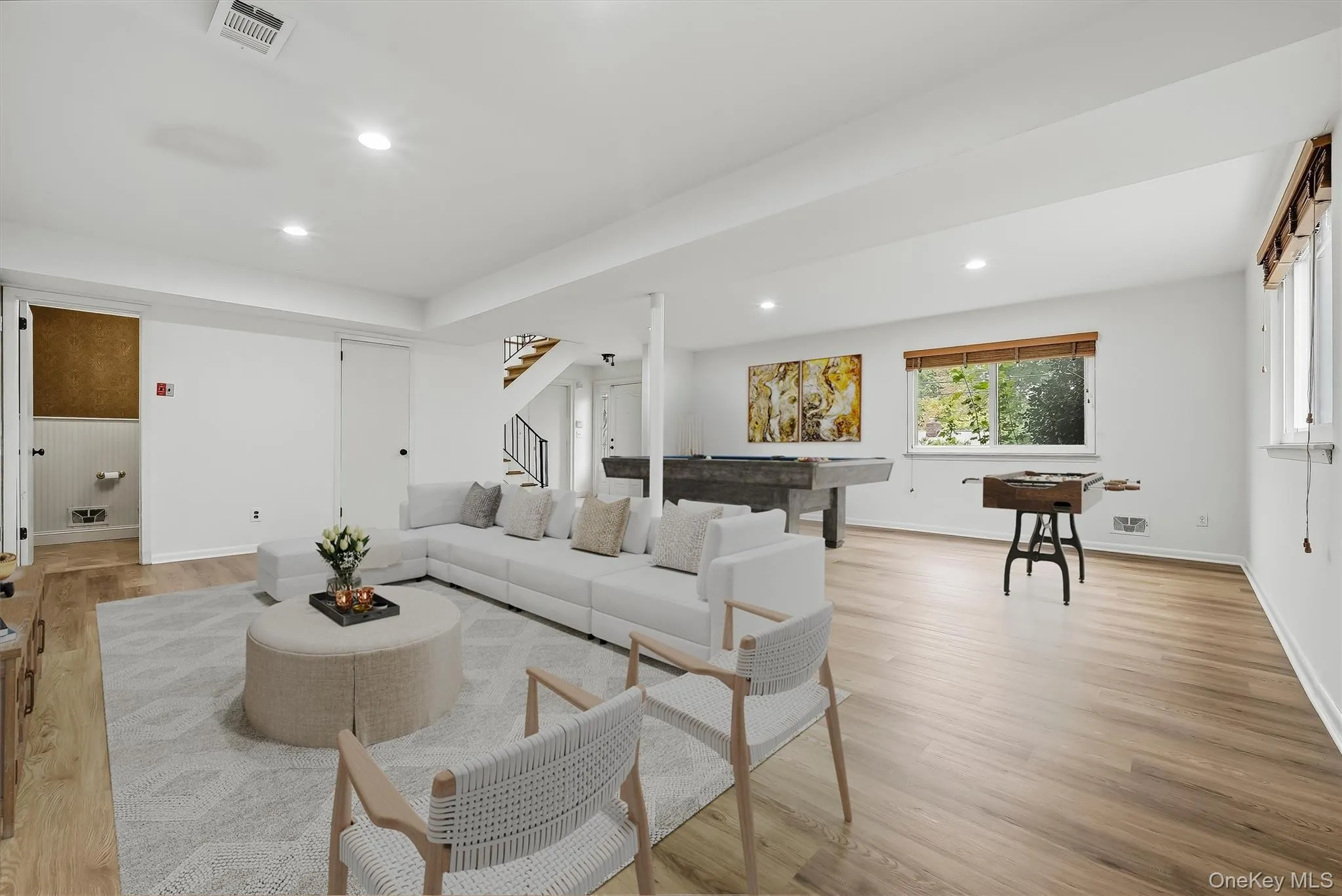 Virtually staged lower level with brand new floors & fresh paint. Virtually staged lower level with brand new floors & fresh paint.