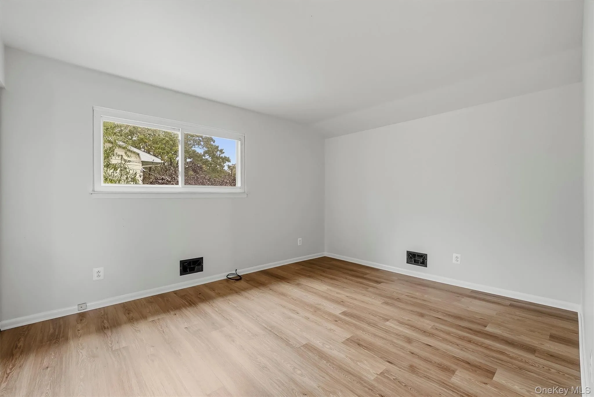 2nd bedroom with brand new floors. 2nd bedroom with brand new floors.
