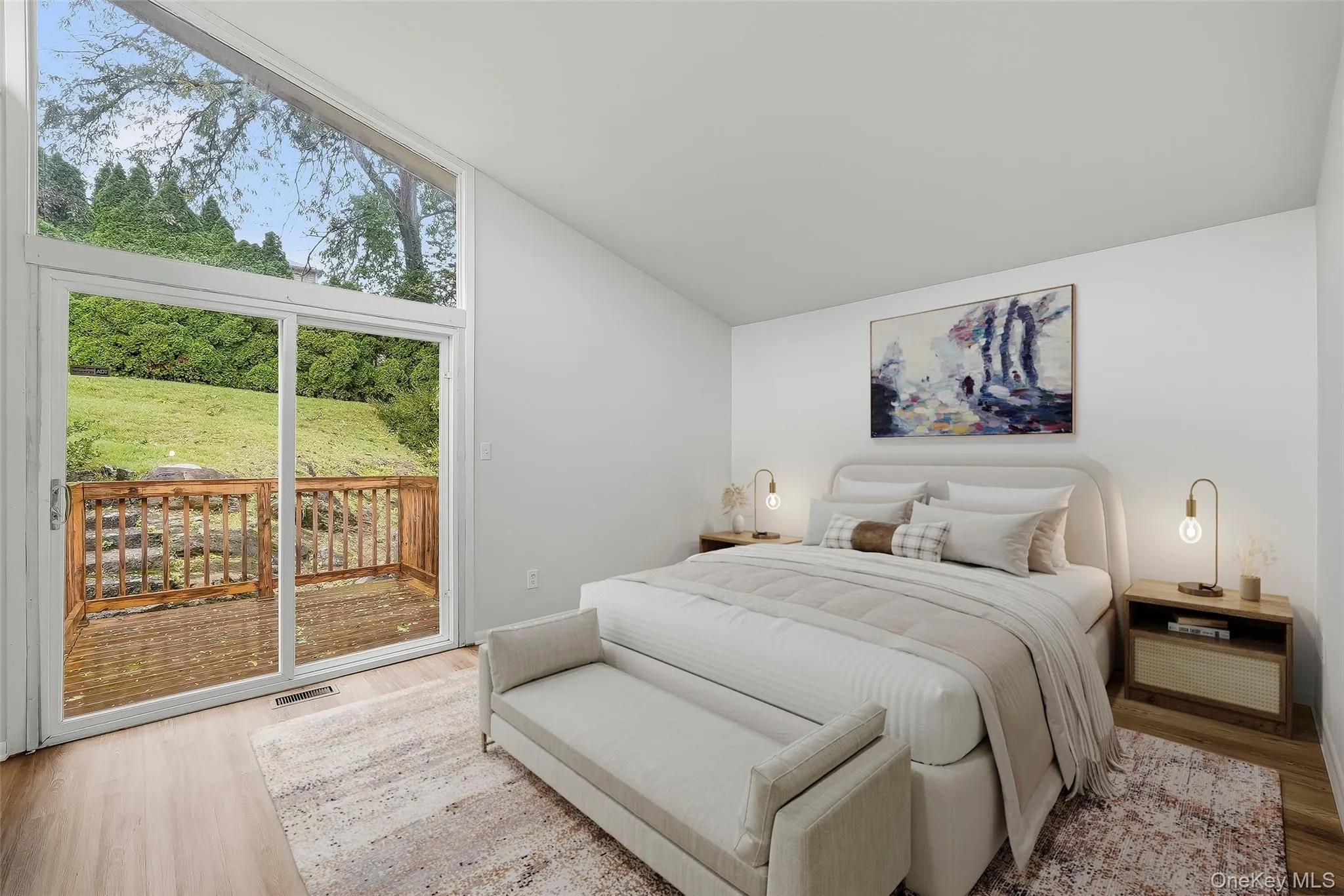 Virtually staged primary bedroom with brand new floors, en-suite bathroom, & walk-in closet. Virtually staged primary bedroom with brand new floors, en-suite bathroom, & walk-in closet.