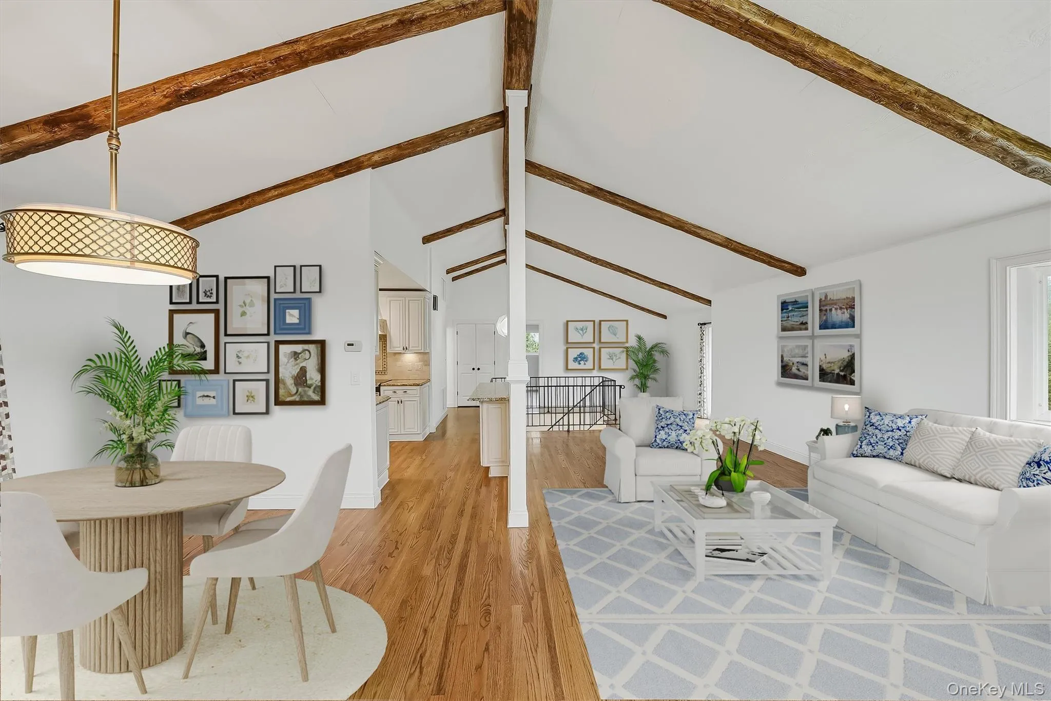 Virtually staged open-plan great room w/ hardwood floors, exposed wood beams, and fresh paint. Virtually staged open-plan great room w/ hardwood floors, exposed wood beams, and fresh paint.