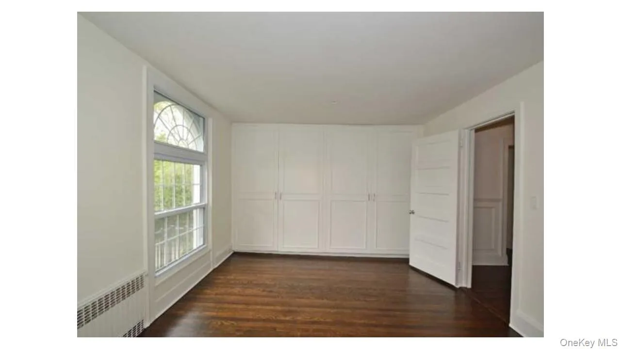 Hardwood flooring and built-in cabinetry enhance this room Hardwood flooring and built-in cabinetry enhance this room