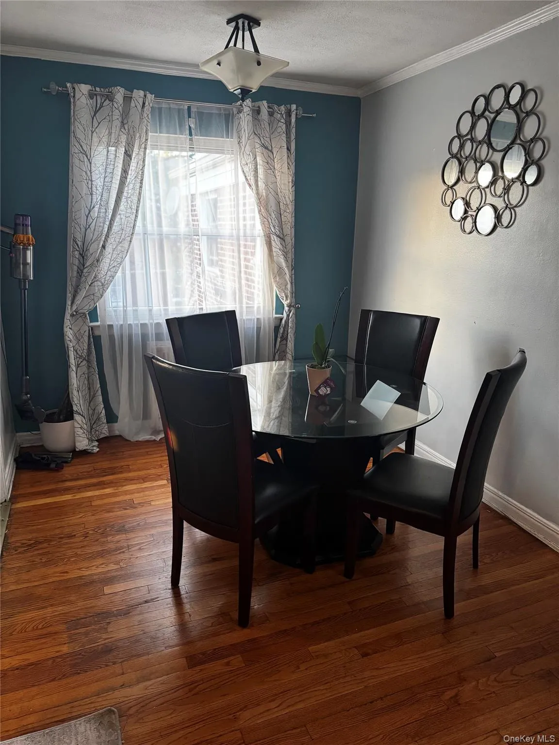 Hardwood flooring, crown molding, and two-tone wall finishes Hardwood flooring, crown molding, and two-tone wall finishes