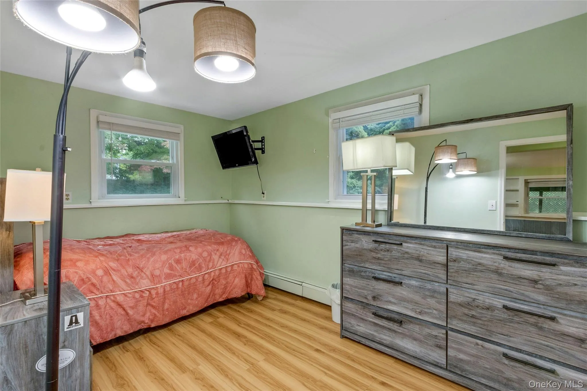 Wood-finish flooring with light green walls Wood-finish flooring with light green walls