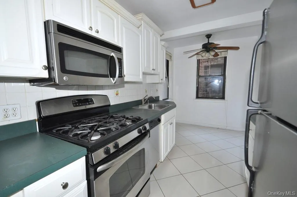 Eat-in-kitchen has stainless steel appliances . Eat-in-kitchen has stainless steel appliances .
