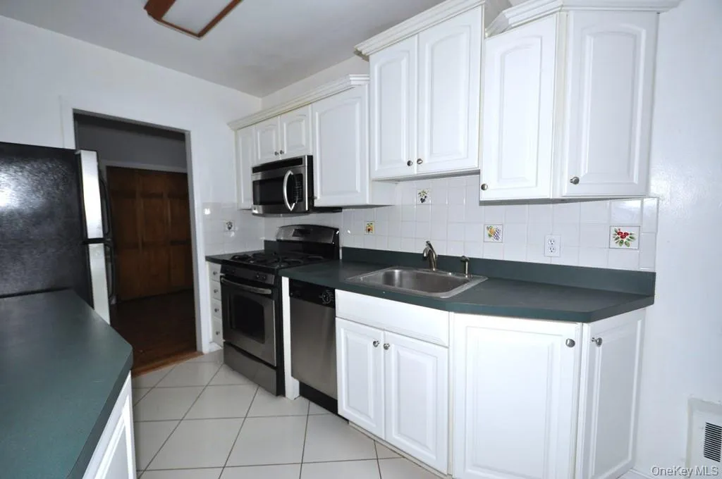 Eat-in-kitchen has stainless steel appliances . Eat-in-kitchen has stainless steel appliances .
