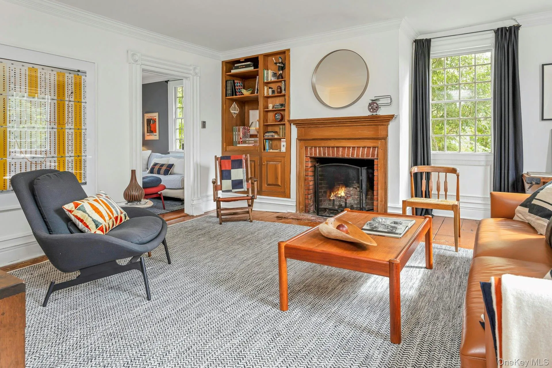 Another beautiful fireplace, high ceilings and over-sized windows Another beautiful fireplace, high ceilings and over-sized windows