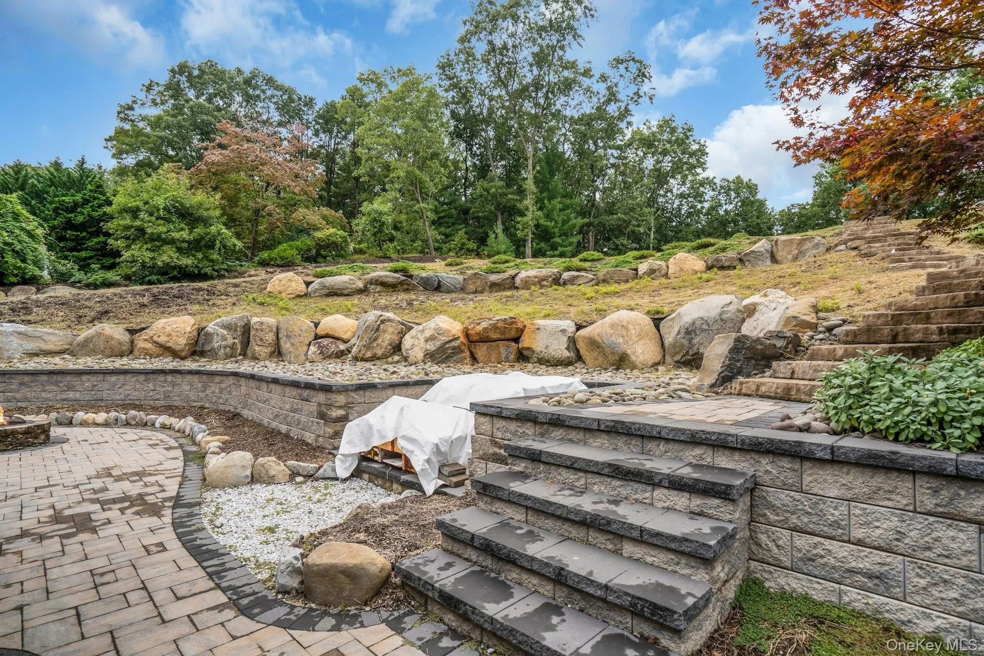 All new retaining walls and stone staircase with area for a hot tub. All new retaining walls and stone staircase with area for a hot tub.