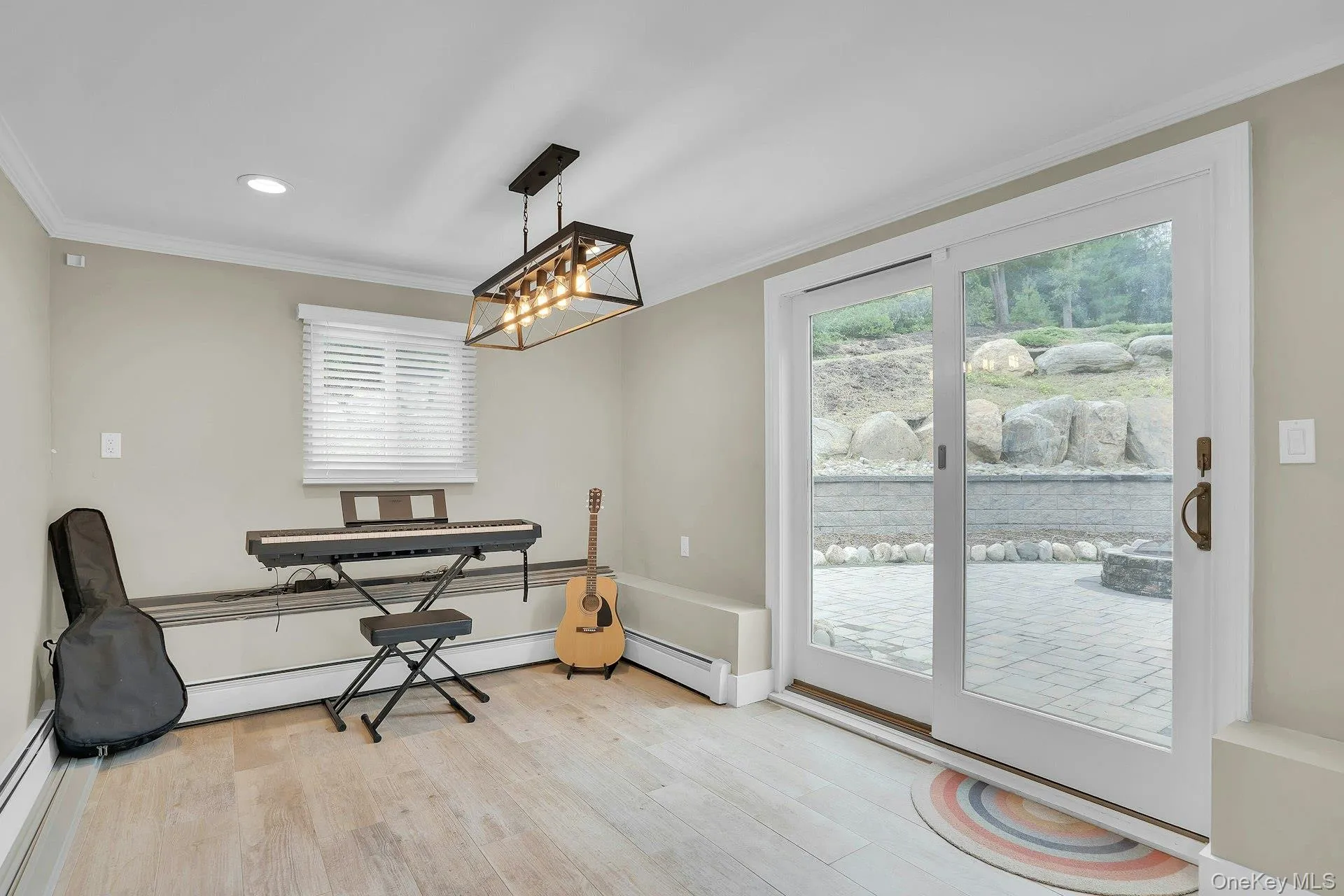 Area for table in summer kitchen with sliders out to patio. Area for table in summer kitchen with sliders out to patio.