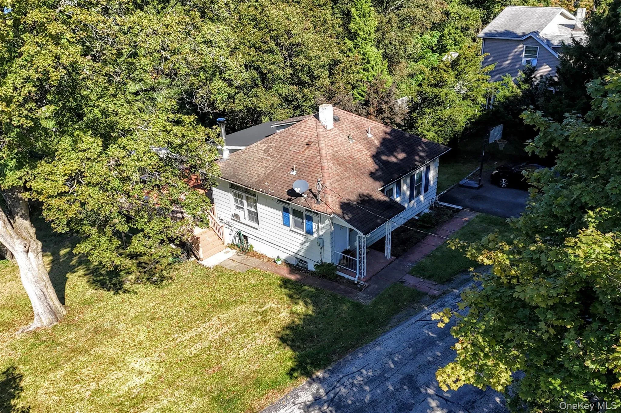 Aerial of house and left side yard Aerial of house and left side yard