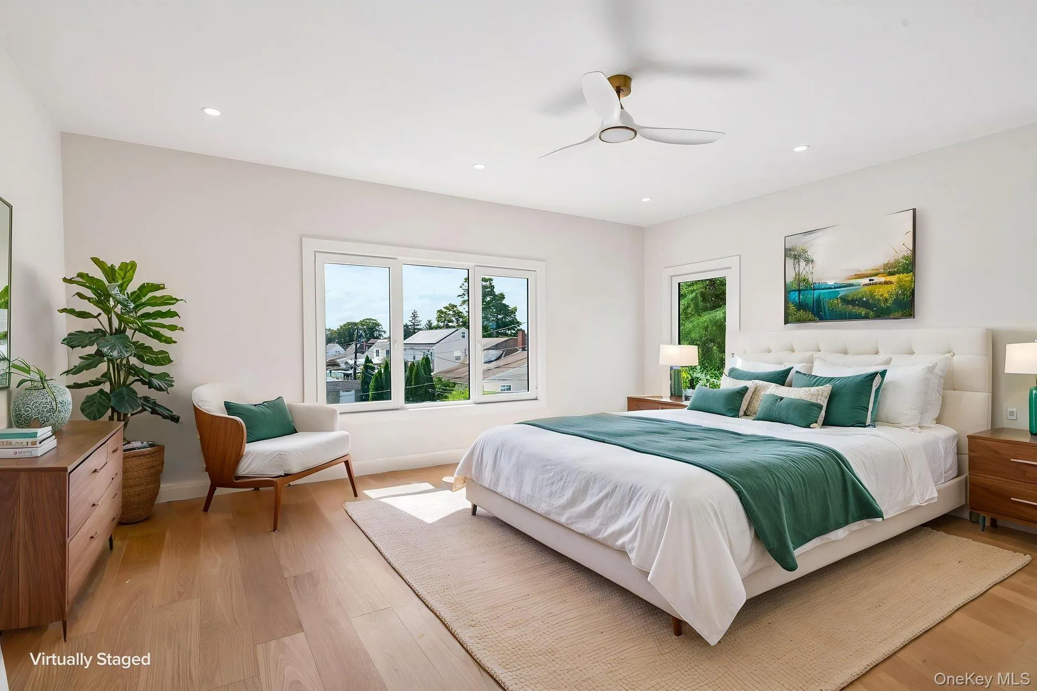 Recessed lighting, wood-finish flooring, white walls, and a ceiling fan Recessed lighting, wood-finish flooring, white walls, and a ceiling fan