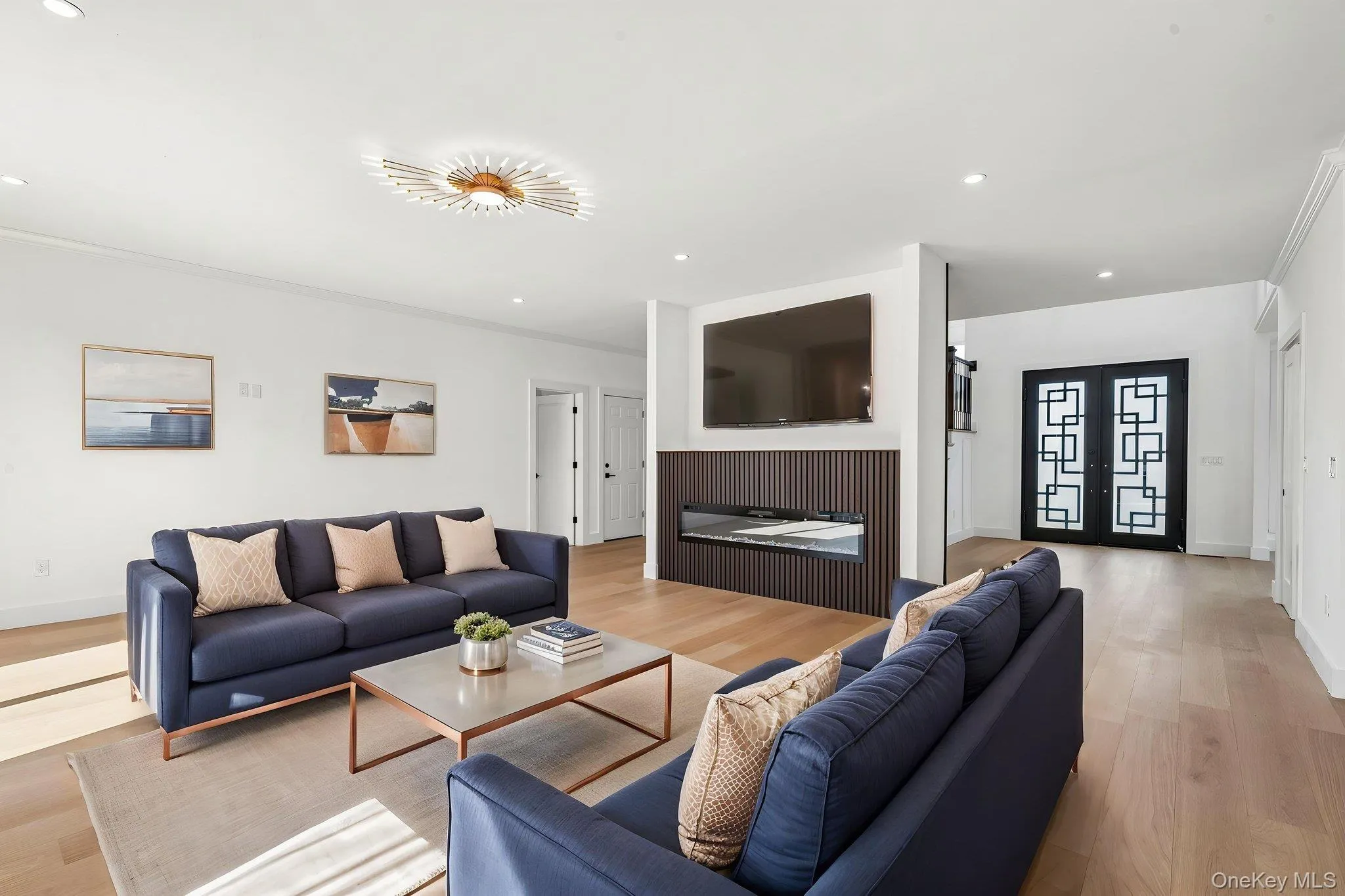 Recessed lighting, wood-finish flooring, and a decorative ceiling fixture Recessed lighting, wood-finish flooring, and a decorative ceiling fixture