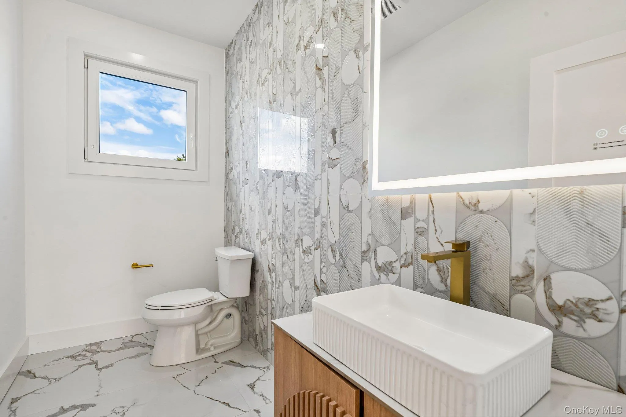 Modern vanity with an integrated rectangular vessel sink and brass-finish faucet Modern vanity with an integrated rectangular vessel sink and brass-finish faucet