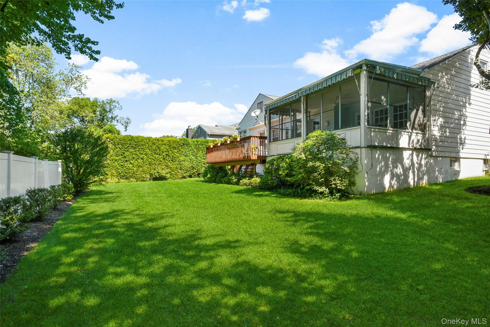 Private level yard with soft green grass and plantings Private level yard with soft green grass and plantings