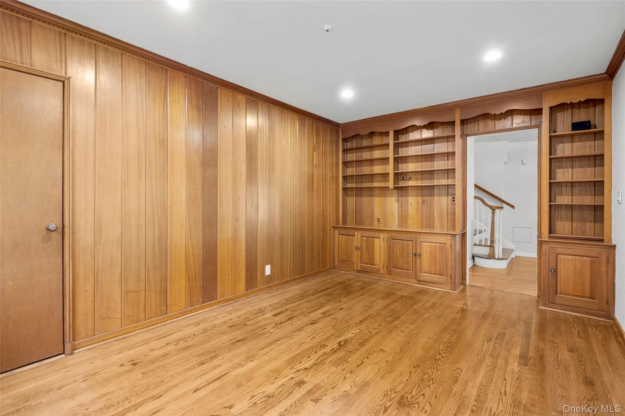1st floor den with built-in bookcases provides a perfect home office, den or guest room 1st floor den with built-in bookcases provides a perfect home office, den or guest room