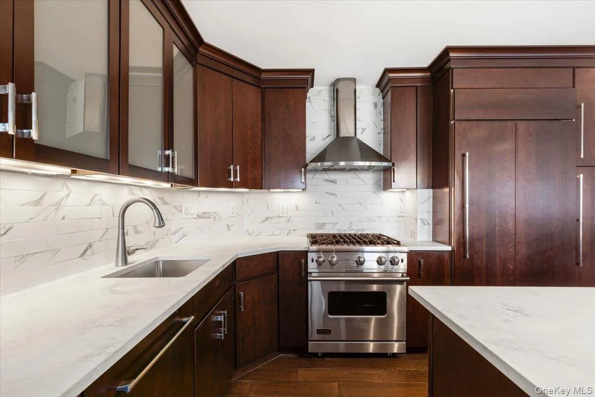 Kitchen featuring premium appliances, new quartz counters Kitchen featuring premium appliances, new quartz counters