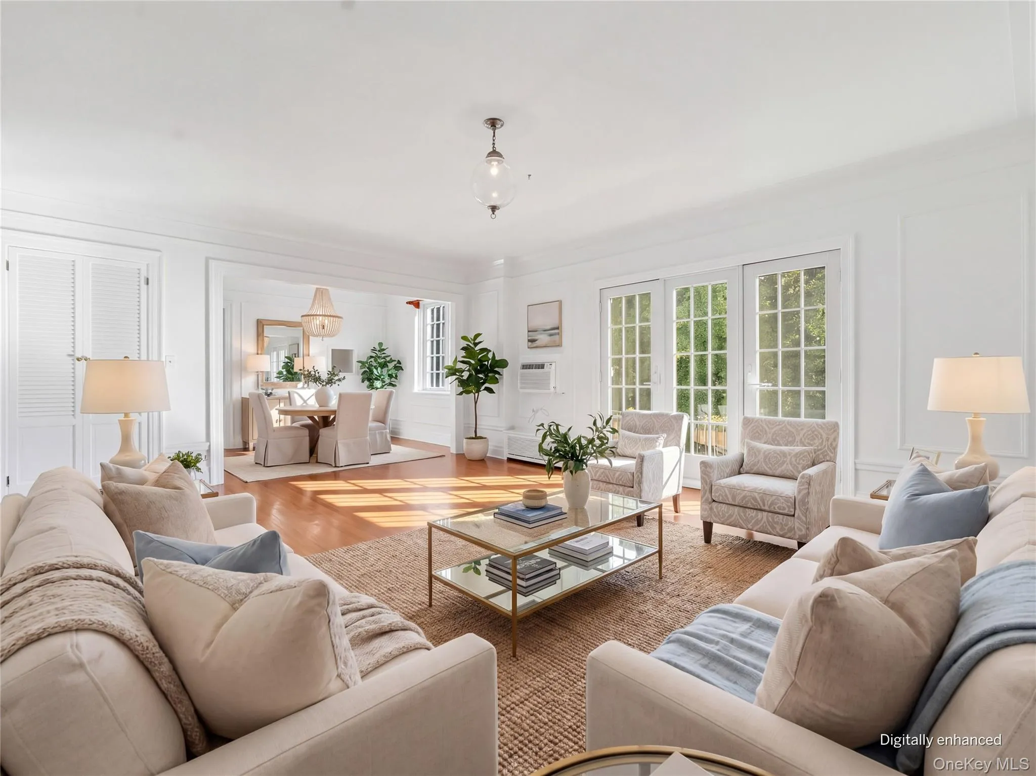 Virtually Staged Sun-Drenched Living Room with Elegant French Doors Looking Toward Dining Room Virtually Staged Sun-Drenched Living Room with Elegant French Doors Looking Toward Dining Room