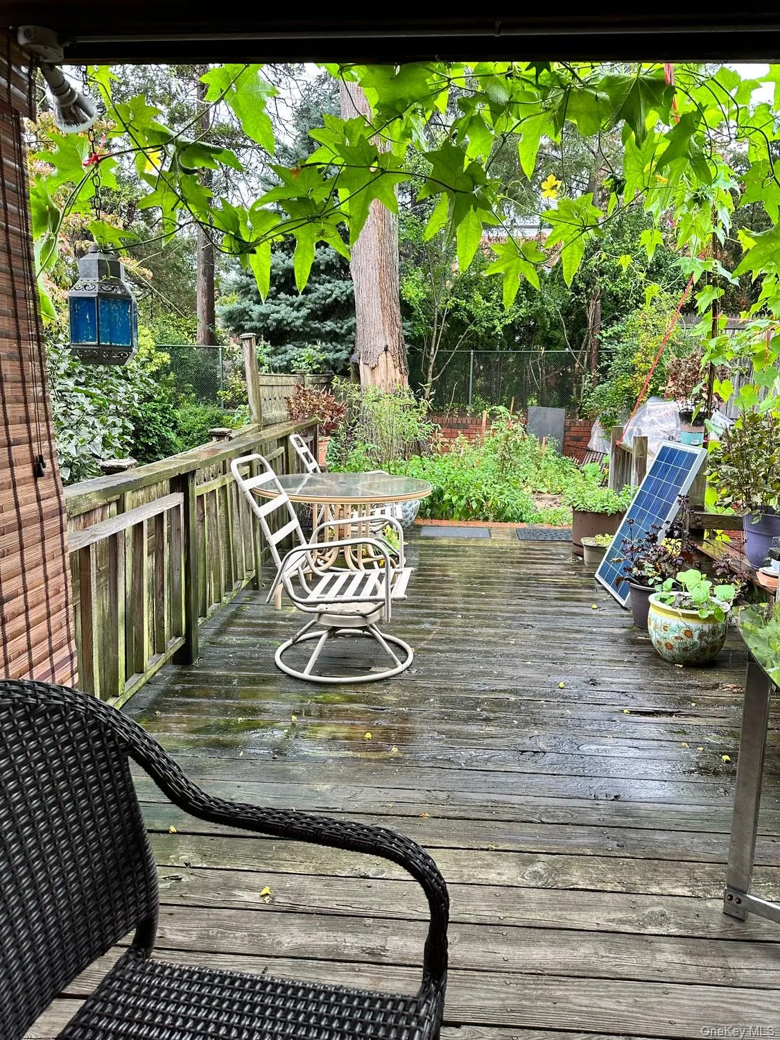 Spacious outdoor deck overlooking a green backyard , perfect for relaxing and entertaining Spacious outdoor deck overlooking a green backyard , perfect for relaxing and entertaining
