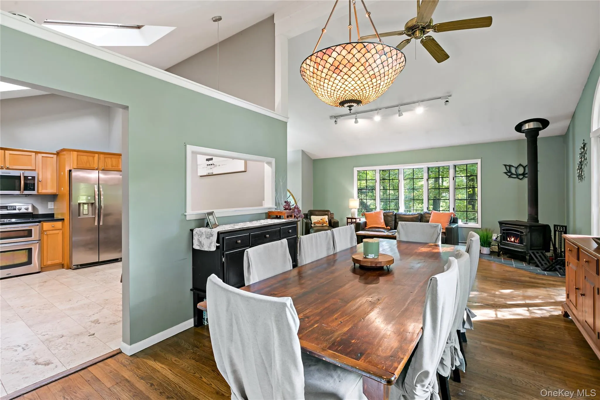 Another angle of formal dining room showing pass through to kitchen. Another angle of formal dining room showing pass through to kitchen.