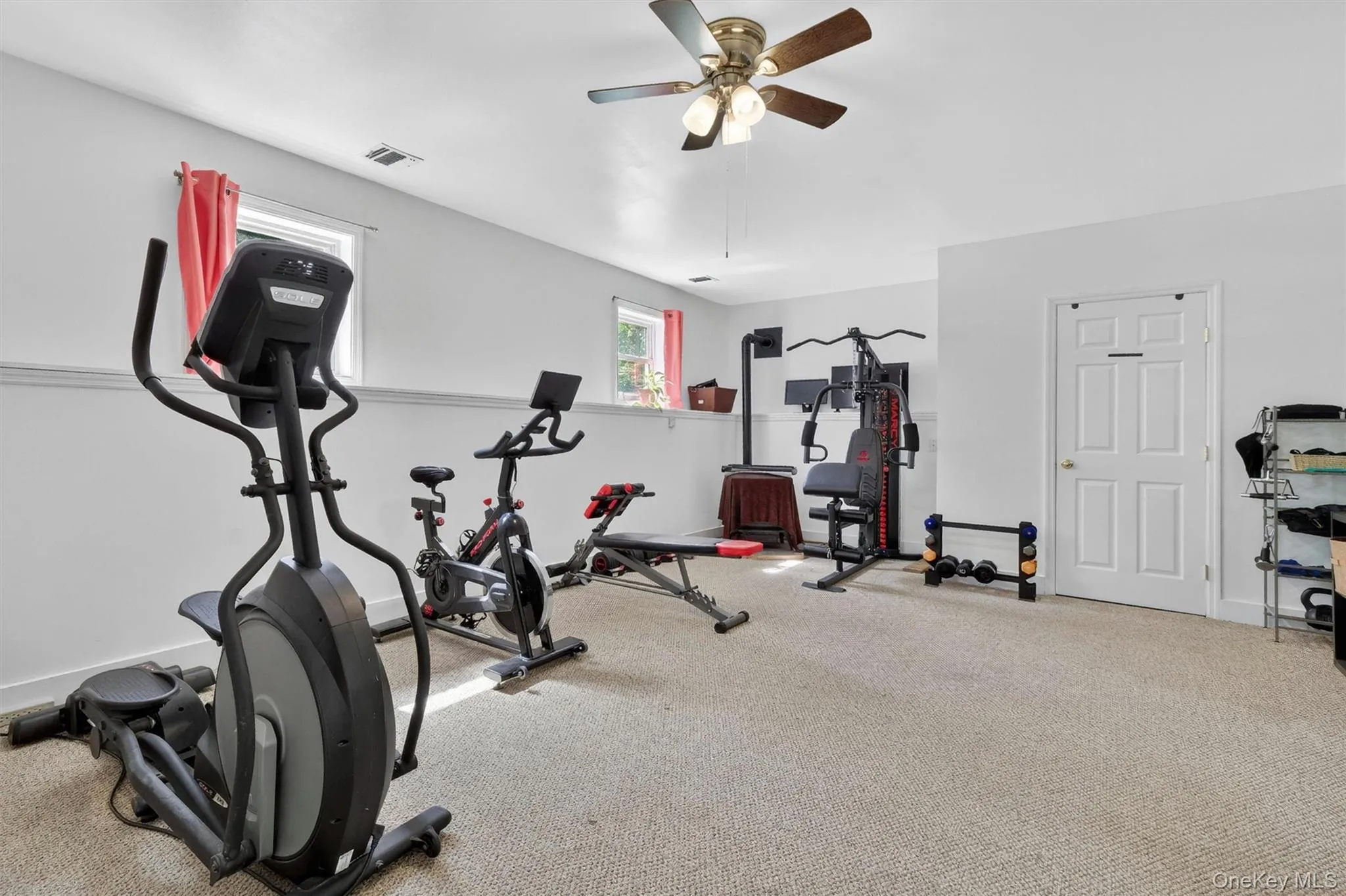 Recessed lighting, ceiling fan, white paneled door, and two windows Recessed lighting, ceiling fan, white paneled door, and two windows