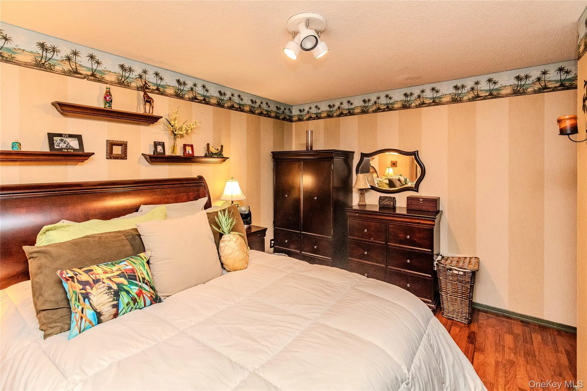 Wood-finish flooring, built-in wall shelves, and a decorative wall border Wood-finish flooring, built-in wall shelves, and a decorative wall border
