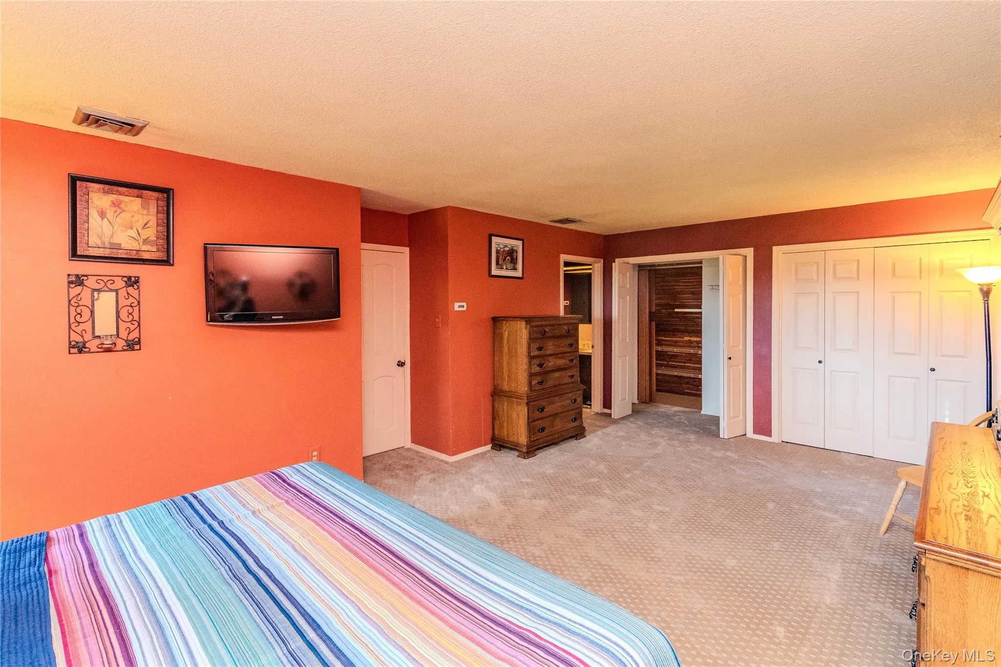 Carpeted flooring throughout, white interior doors, and a closet with bi-fold doors Carpeted flooring throughout, white interior doors, and a closet with bi-fold doors