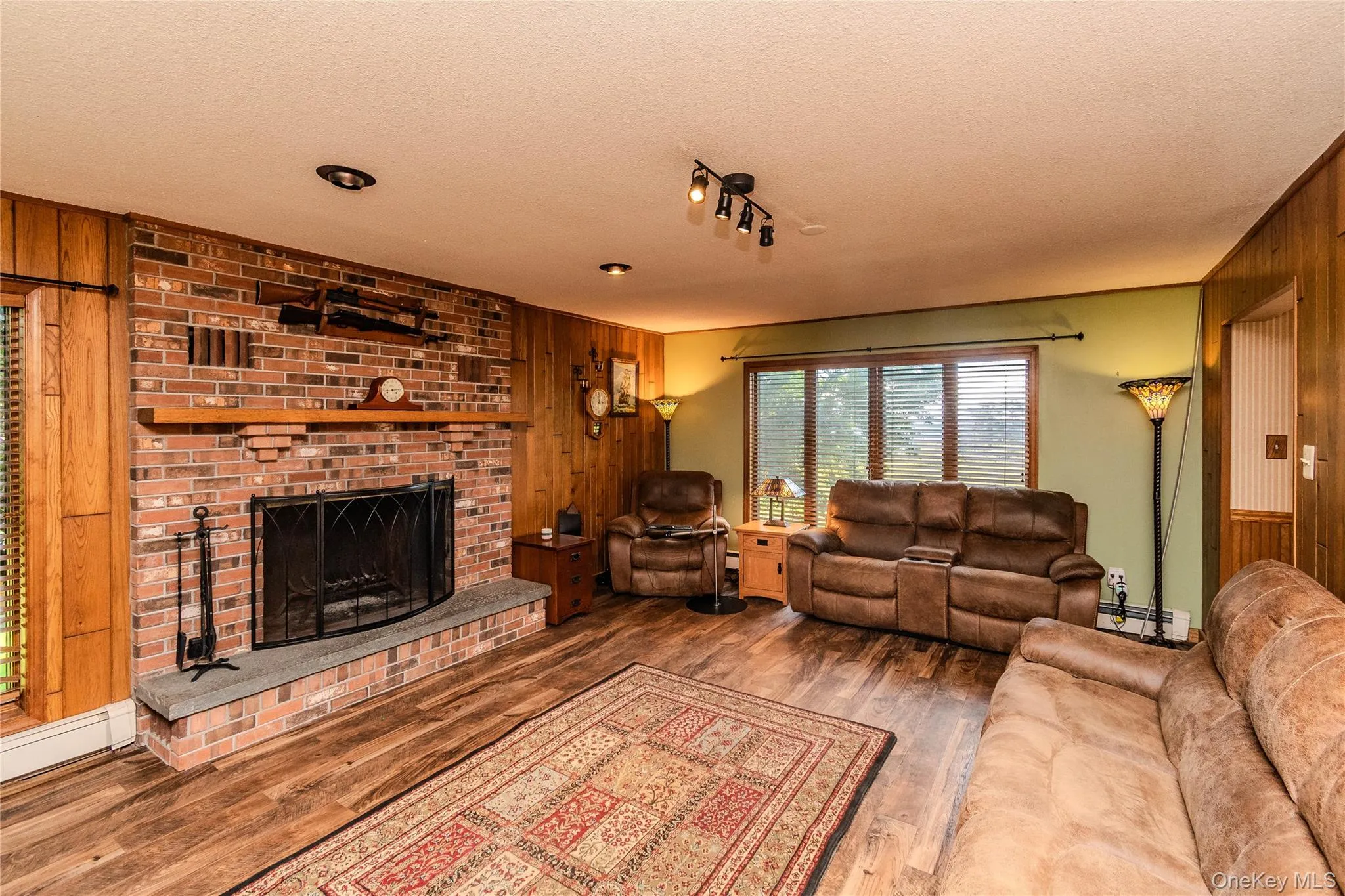 Brick fireplace with a stone hearth and wood mantel Brick fireplace with a stone hearth and wood mantel