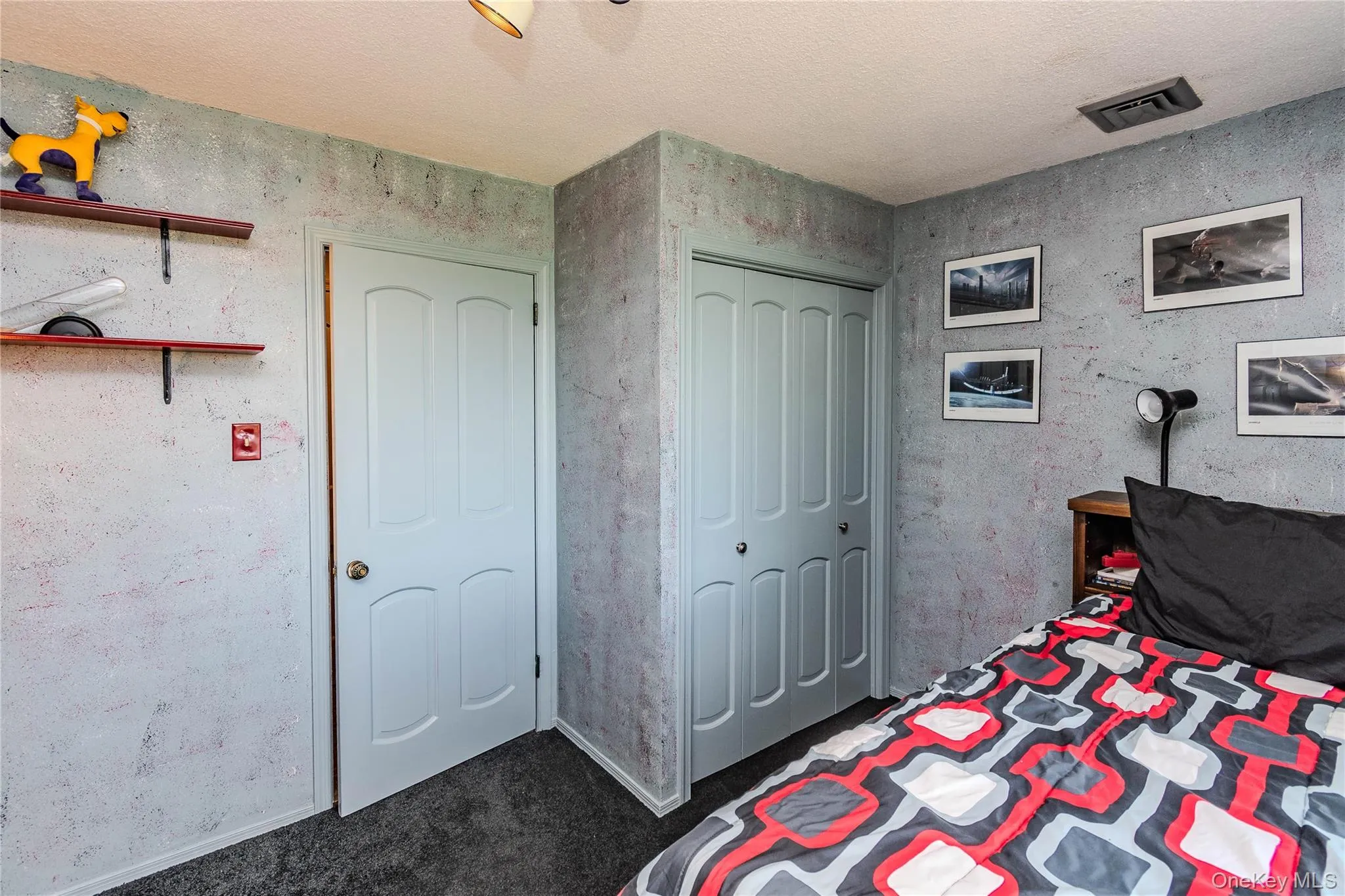 Recessed lighting, light-colored ceiling, textured wall finish, paneled interior door, and bi-fold closet doors Recessed lighting, light-colored ceiling, textured wall finish, paneled interior door, and bi-fold closet doors