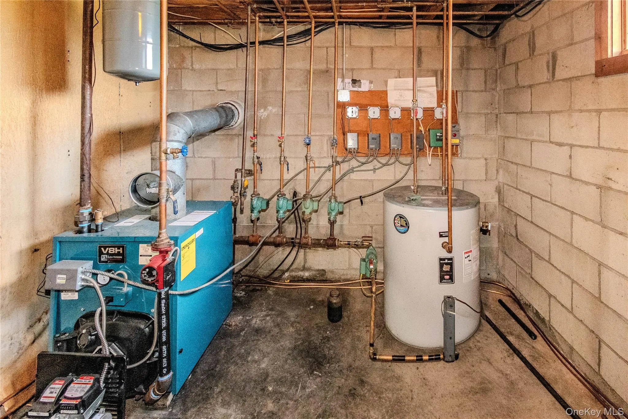 Boiler system featuring copper piping and a water heater Boiler system featuring copper piping and a water heater