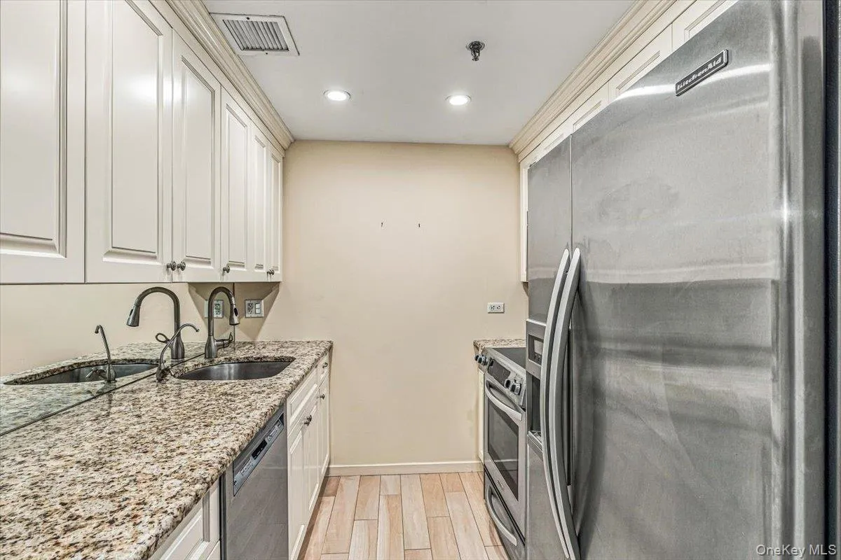 Updated Galley Kitchen with Stainless Steel Appliances Updated Galley Kitchen with Stainless Steel Appliances