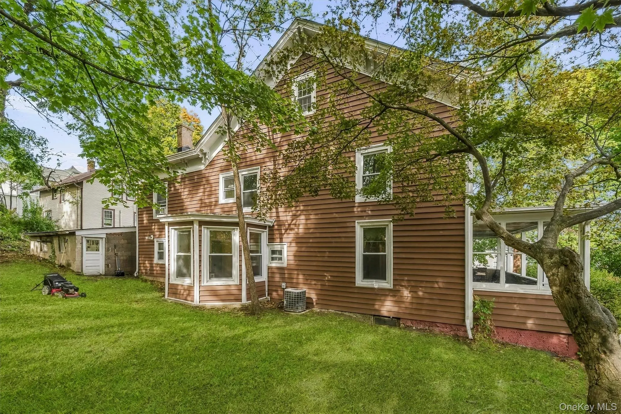 Brown clapboard siding with white trim Brown clapboard siding with white trim