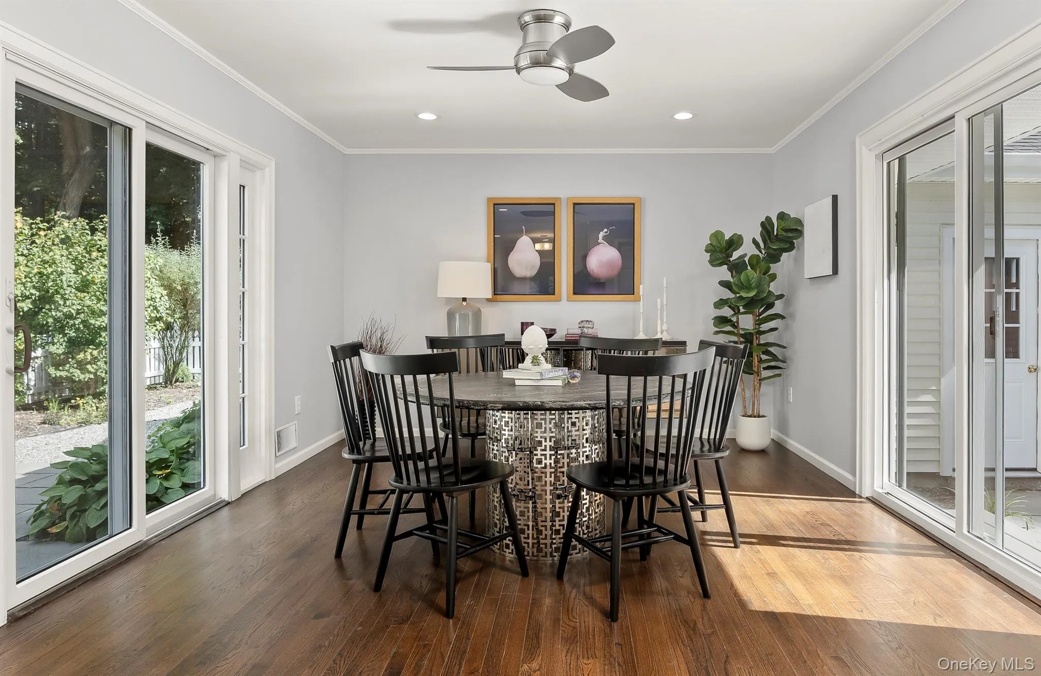Dining area has access to both the patio and the courtyard through glass doors Dining area has access to both the patio and the courtyard through glass doors