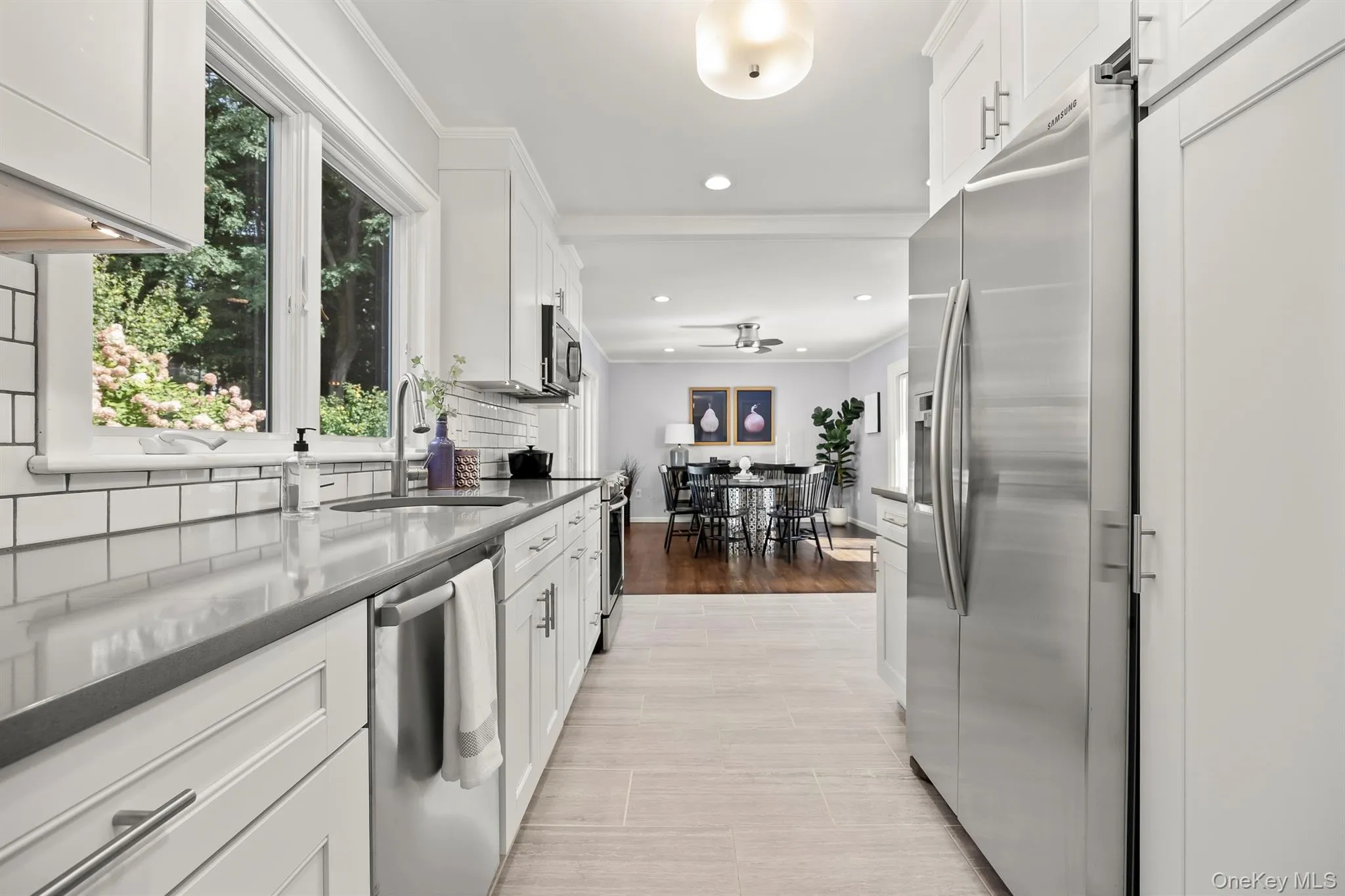 Tastefully renovated kitchen opens up to a spacious dining room/area Tastefully renovated kitchen opens up to a spacious dining room/area