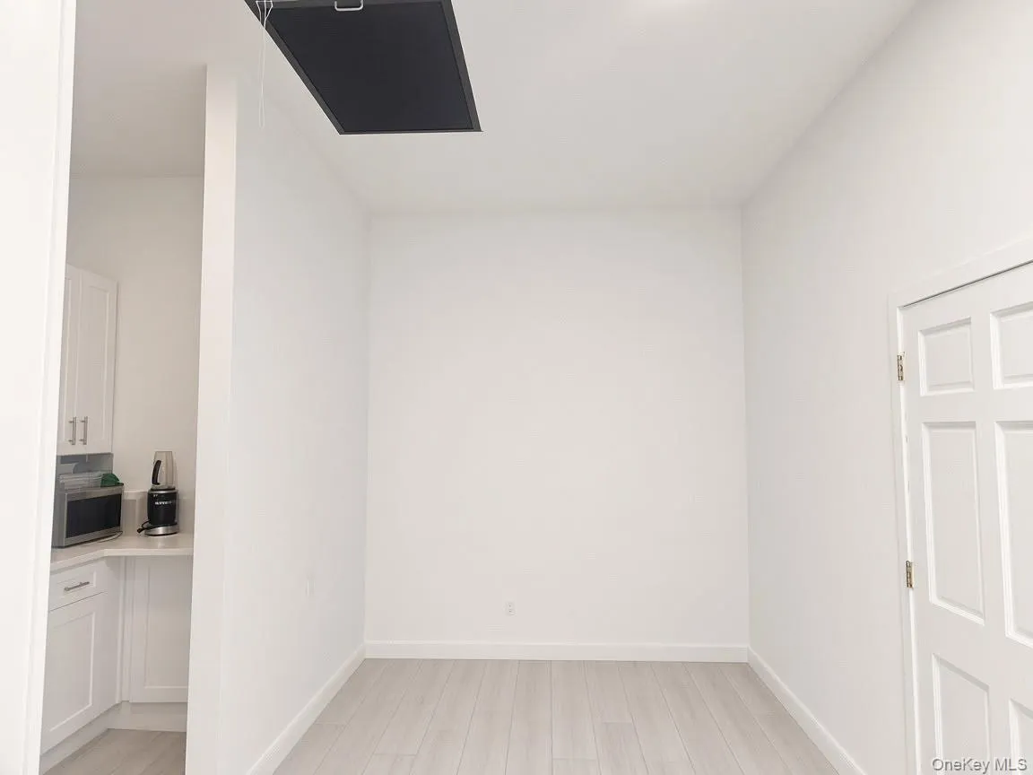Wood-finish flooring with white walls Wood-finish flooring with white walls