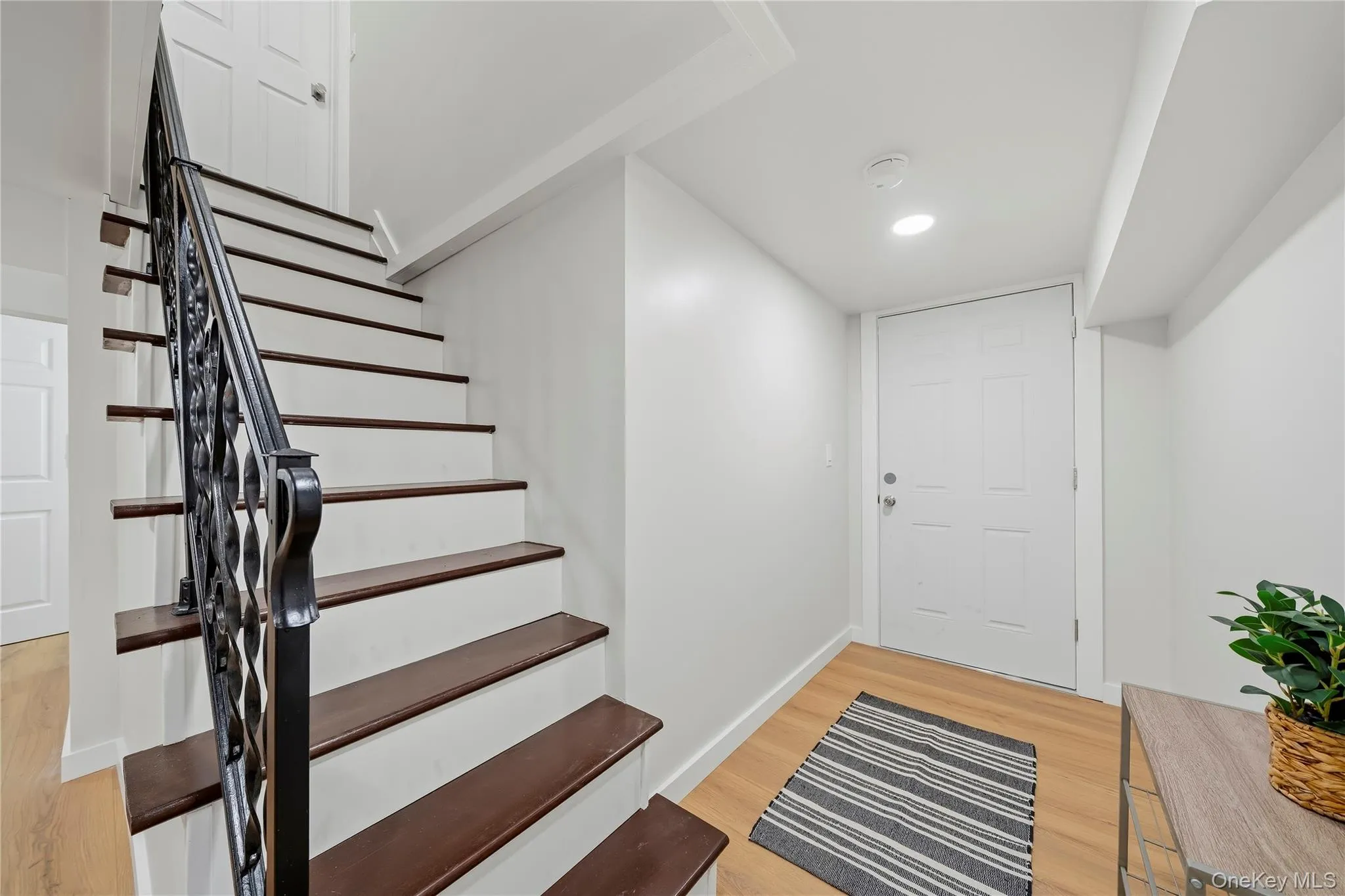 Down to the family room and basement storage area Down to the family room and basement storage area